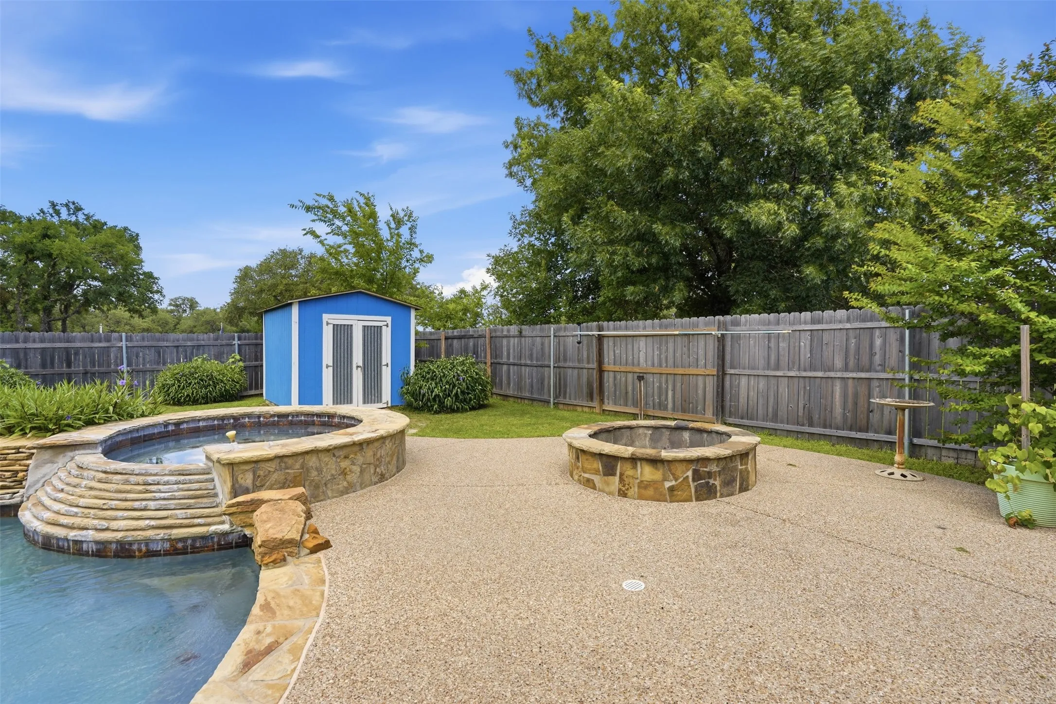 Shed, fire pit and fully fenced back yard!