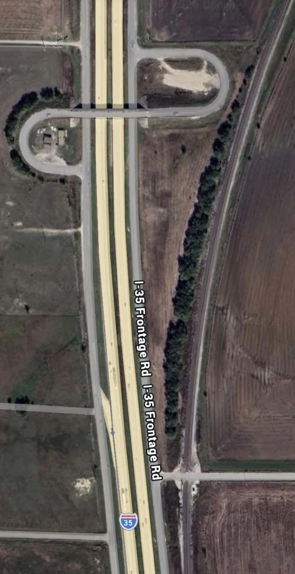 Aerial Map. Illustrating highway I-35 and associated frontage roads with surrounding land parcels
