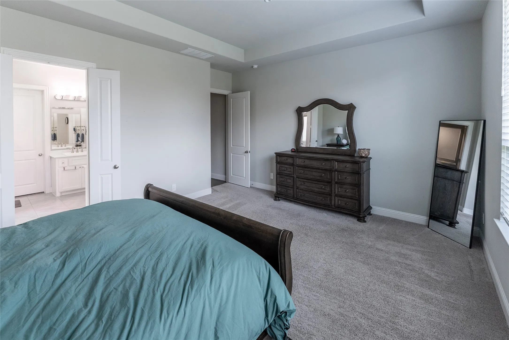 Featuring an en suite bathroom, closet and carpet downstairs.