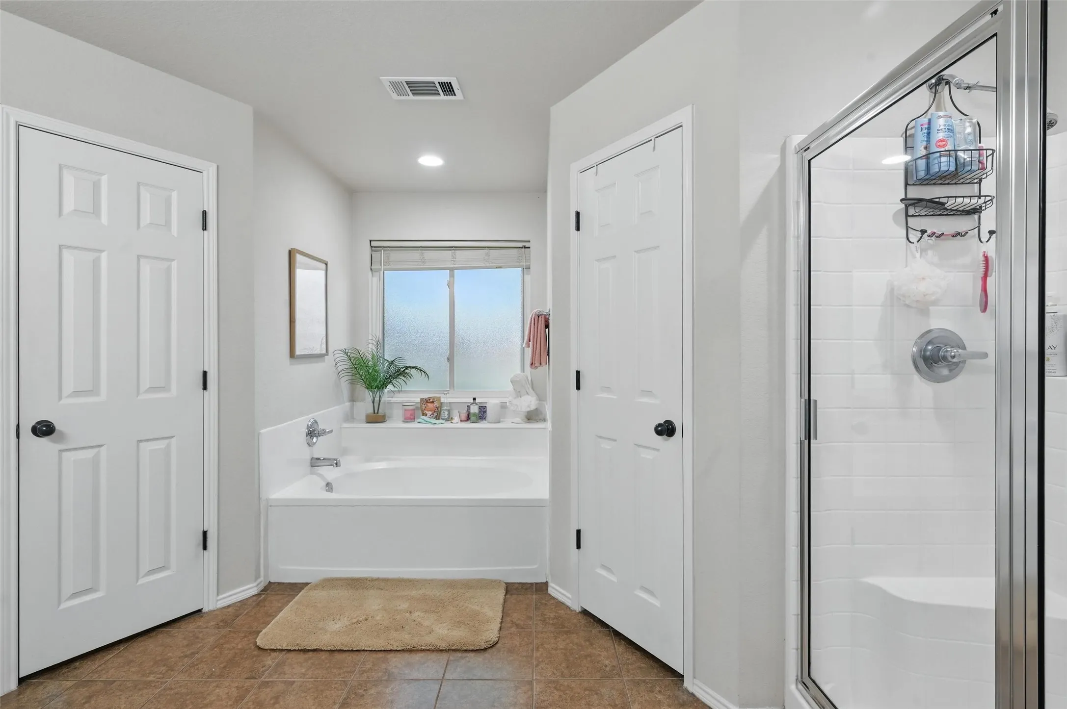 Primary Bath  2 separate walk-in closets