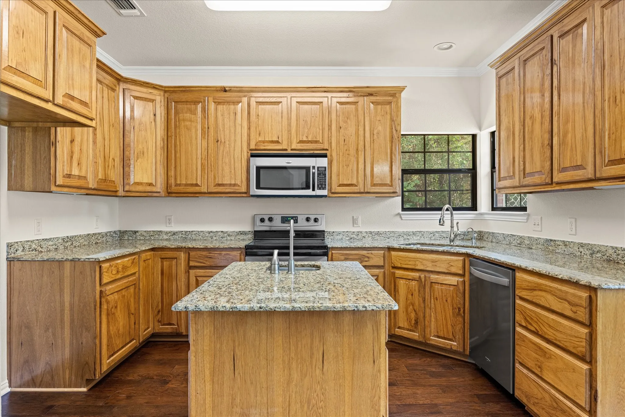 Granite countertops and engineered hardwood floors