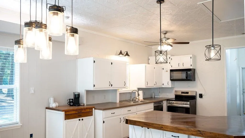 Dining lighting coordinates with kitchen lighting