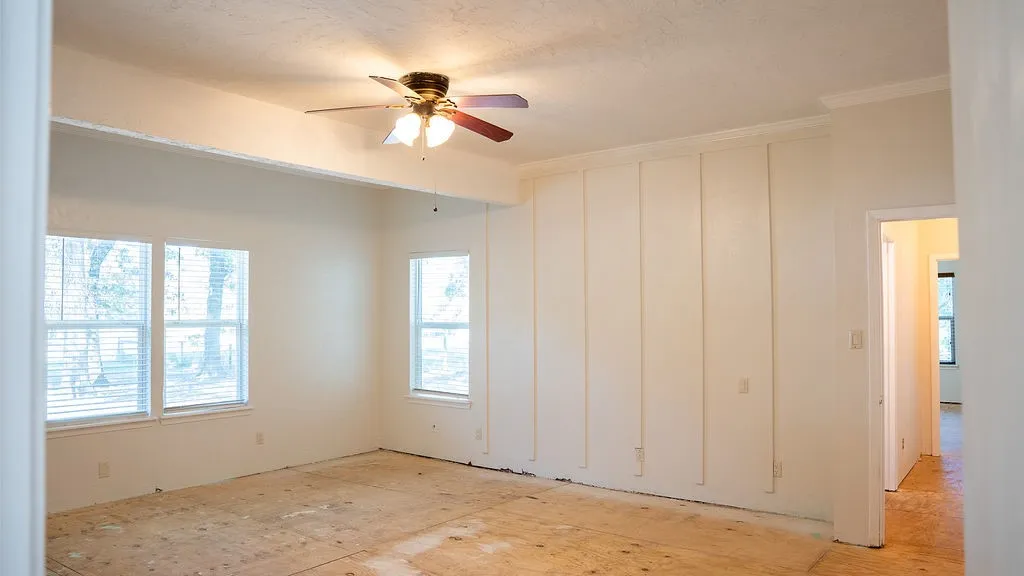 Primary bedroom is located at back of home.