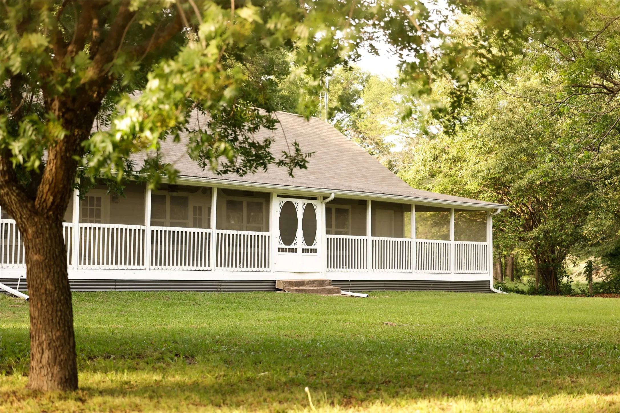 Front screened porch provides opportunity to enjoy the view year round.