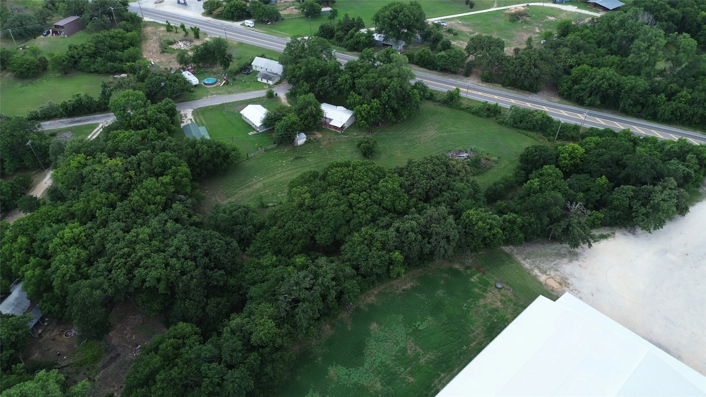 Expansive property featuring mature trees and open green spaces