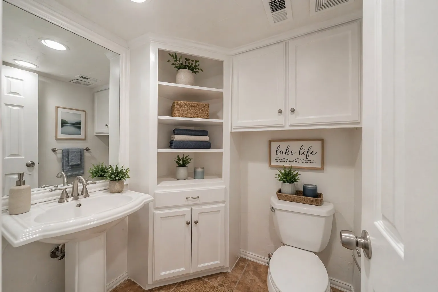 Half Bathroom off of main living level.  Digitally staged to show potential.