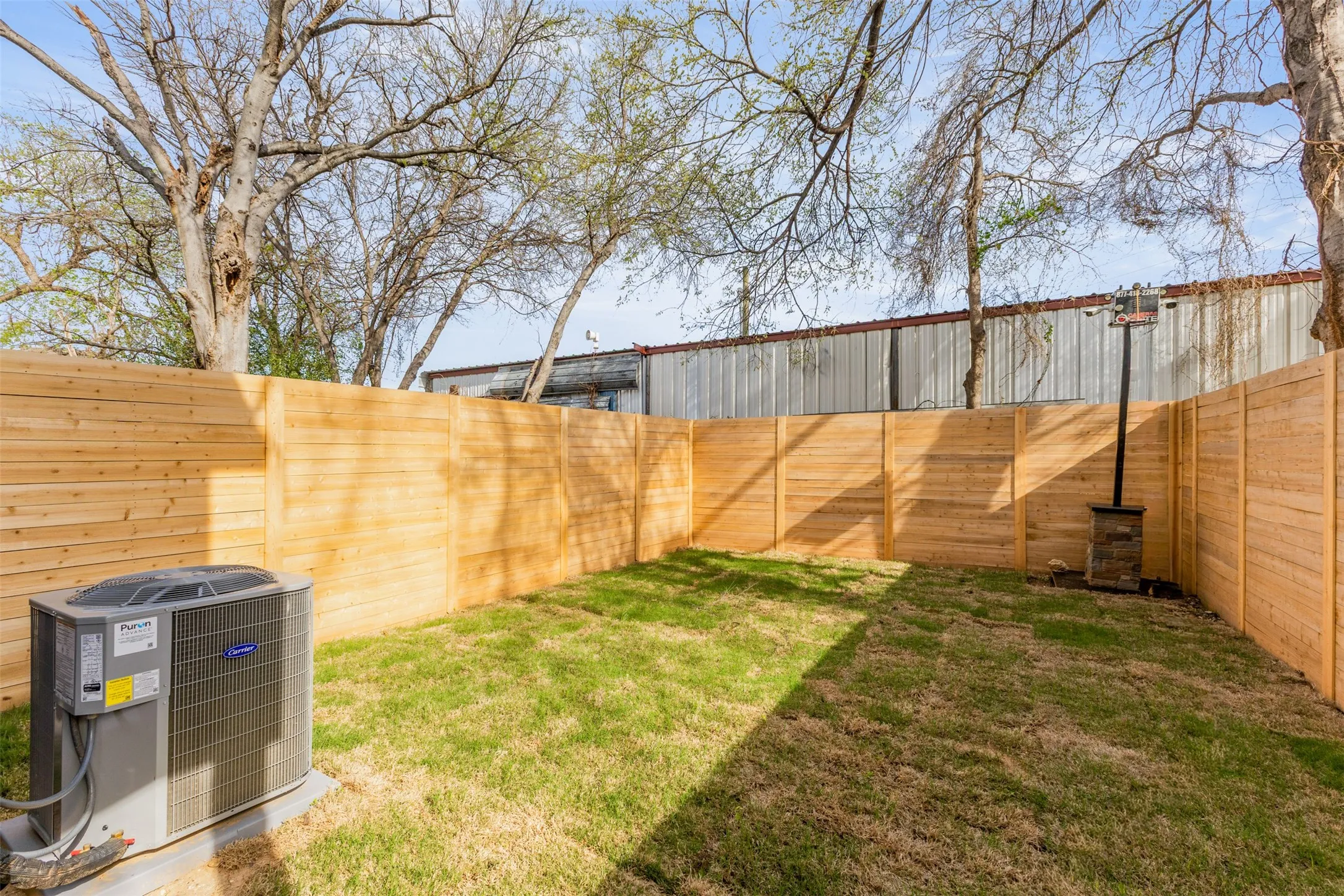 View of fenced backyard