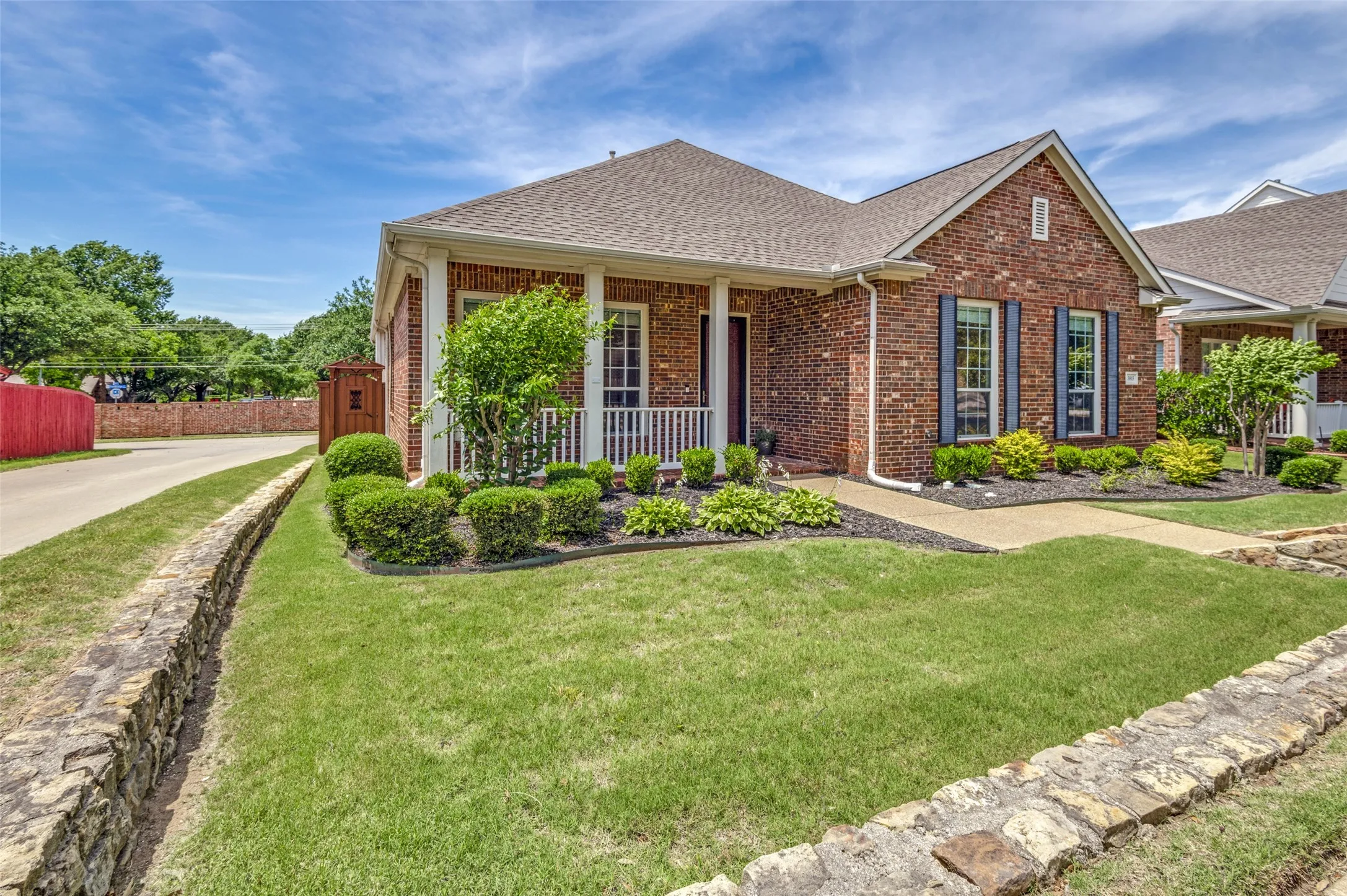 Great corner lot location gives quick access to the alley. Beautifully detailed wooden gate adds to the cottage vibe!