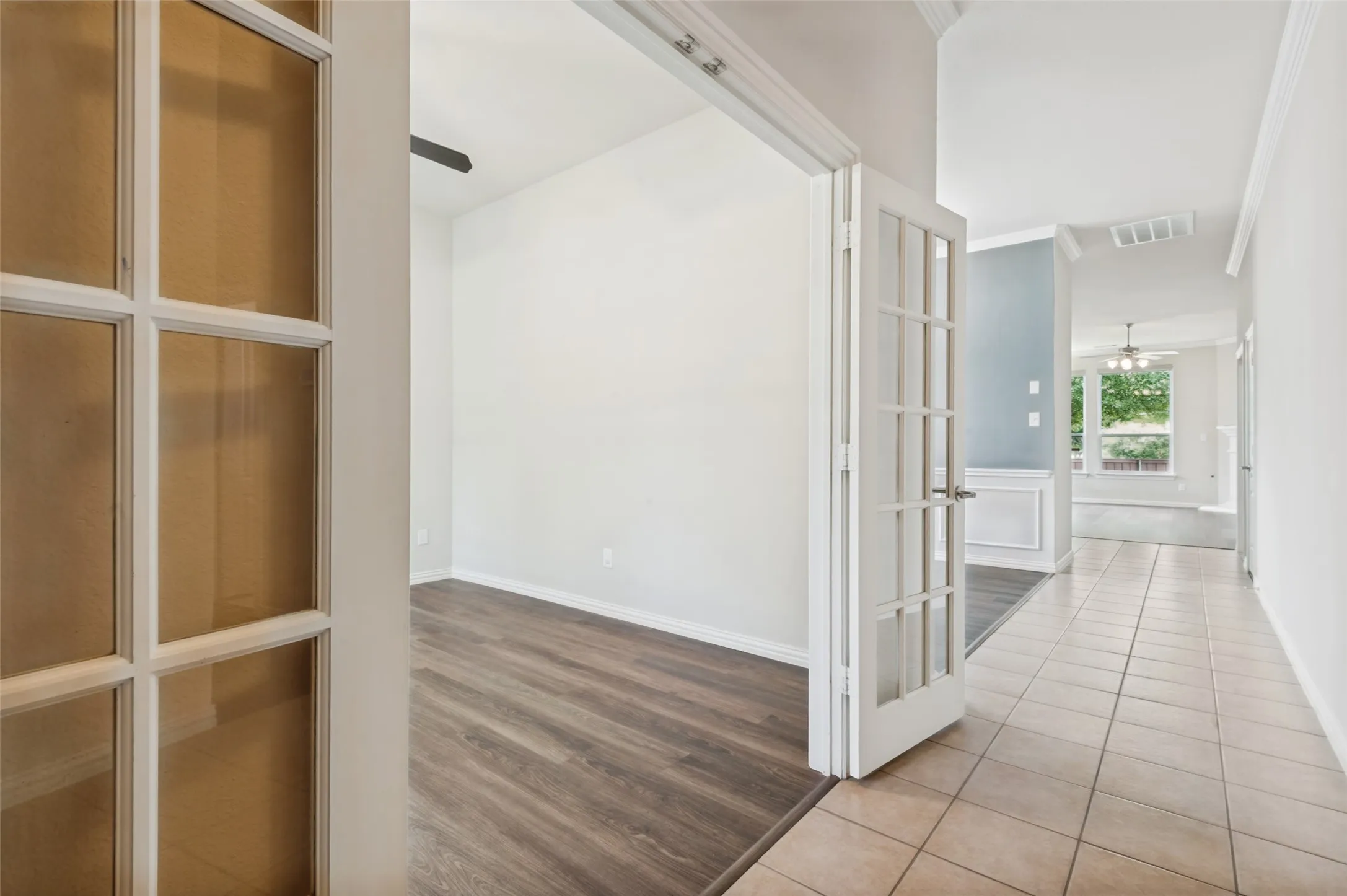 French doors open to the office. Luxury vinyl plank flooring.