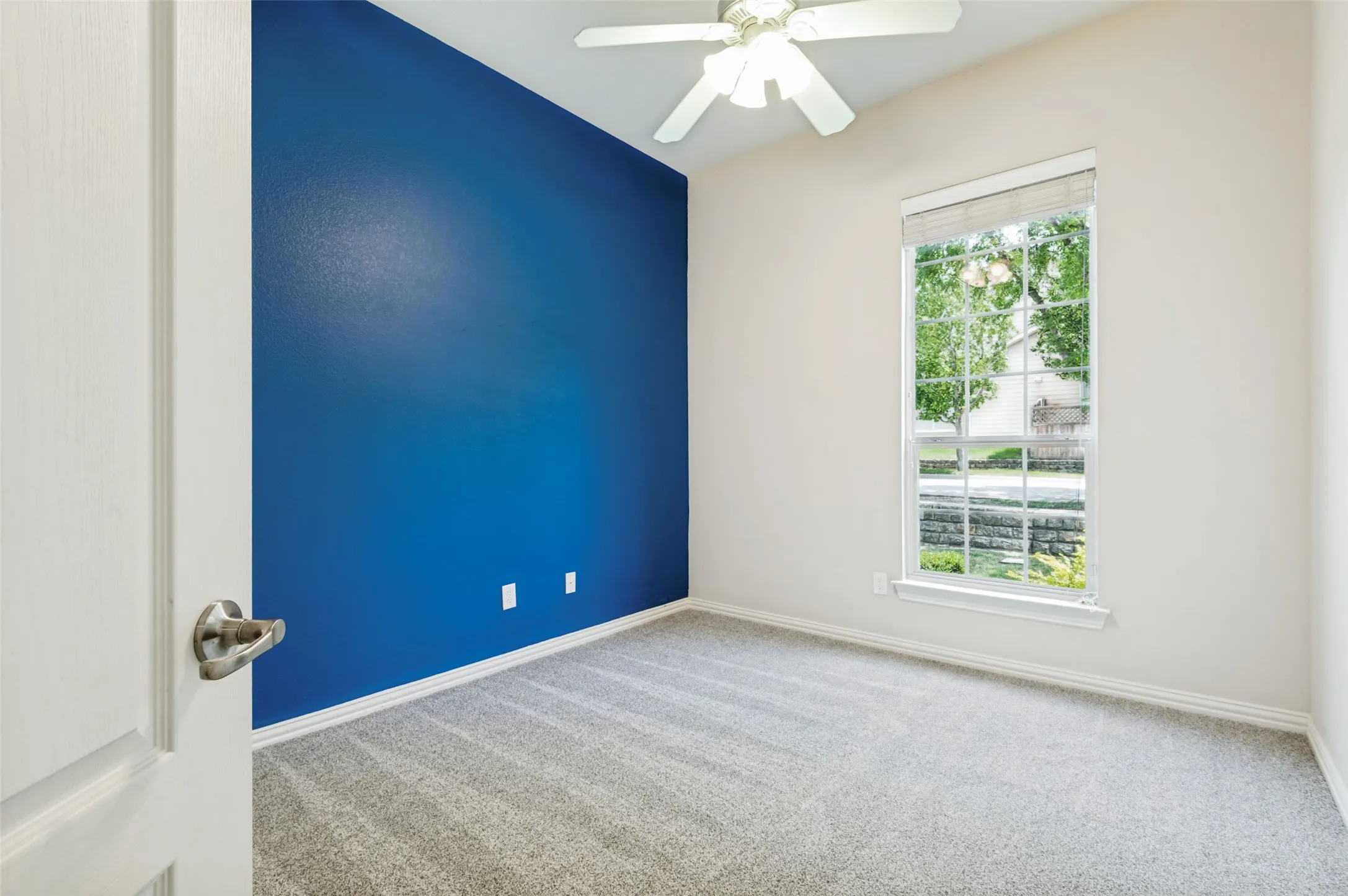 Room featuring a single accent wall, neutral wall tones, large closet, and newly installed carpeting.