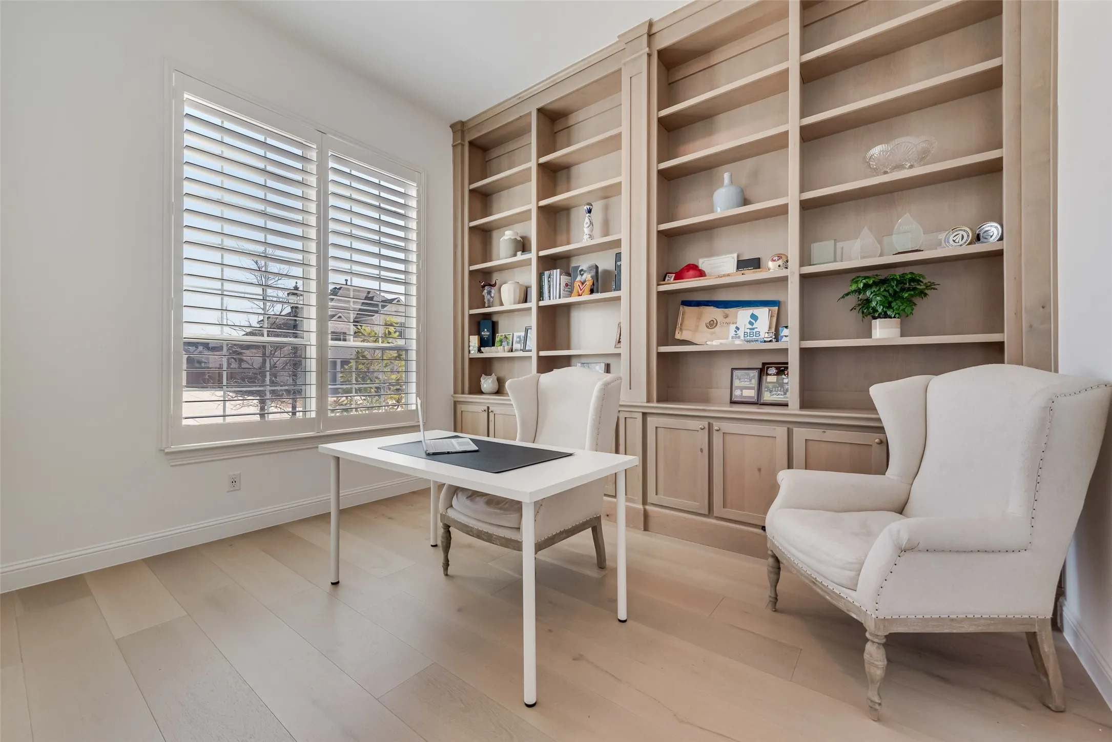 Office with floor to ceiling custom cabinets.