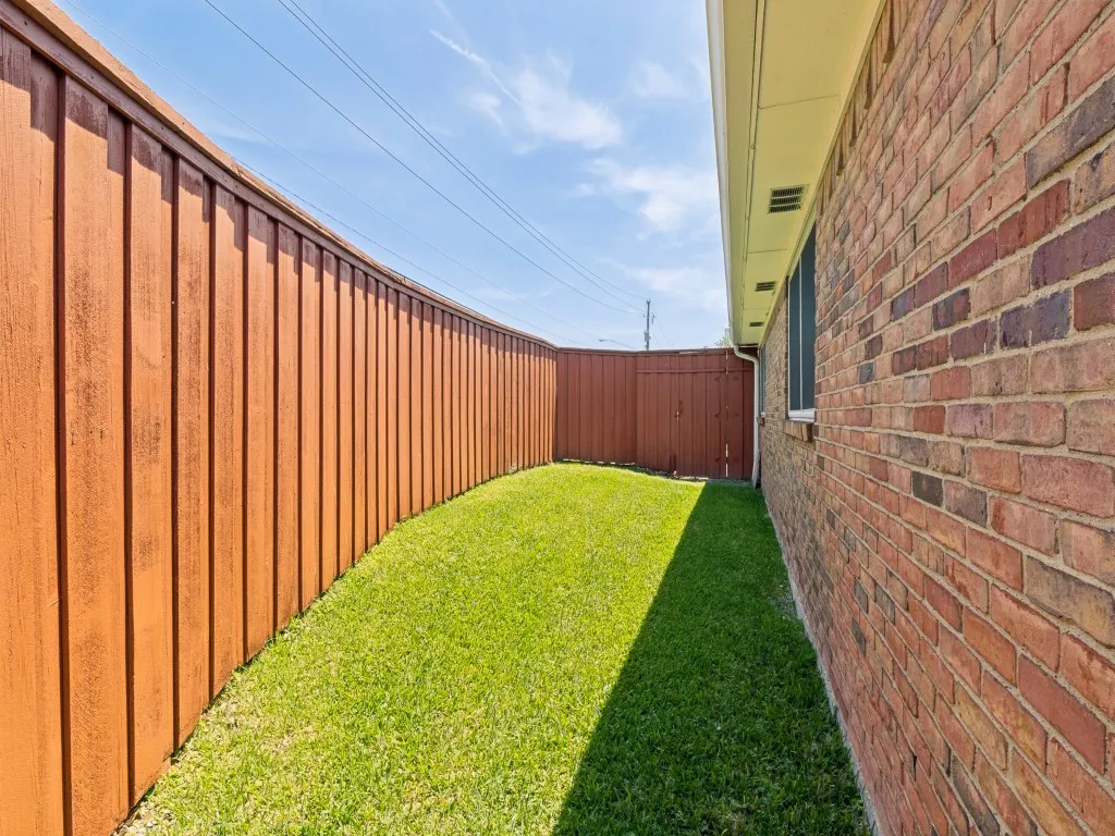 Perfectly suited for pets, the side yard makes an excellent dog run with access from both the back driveway and the yard!