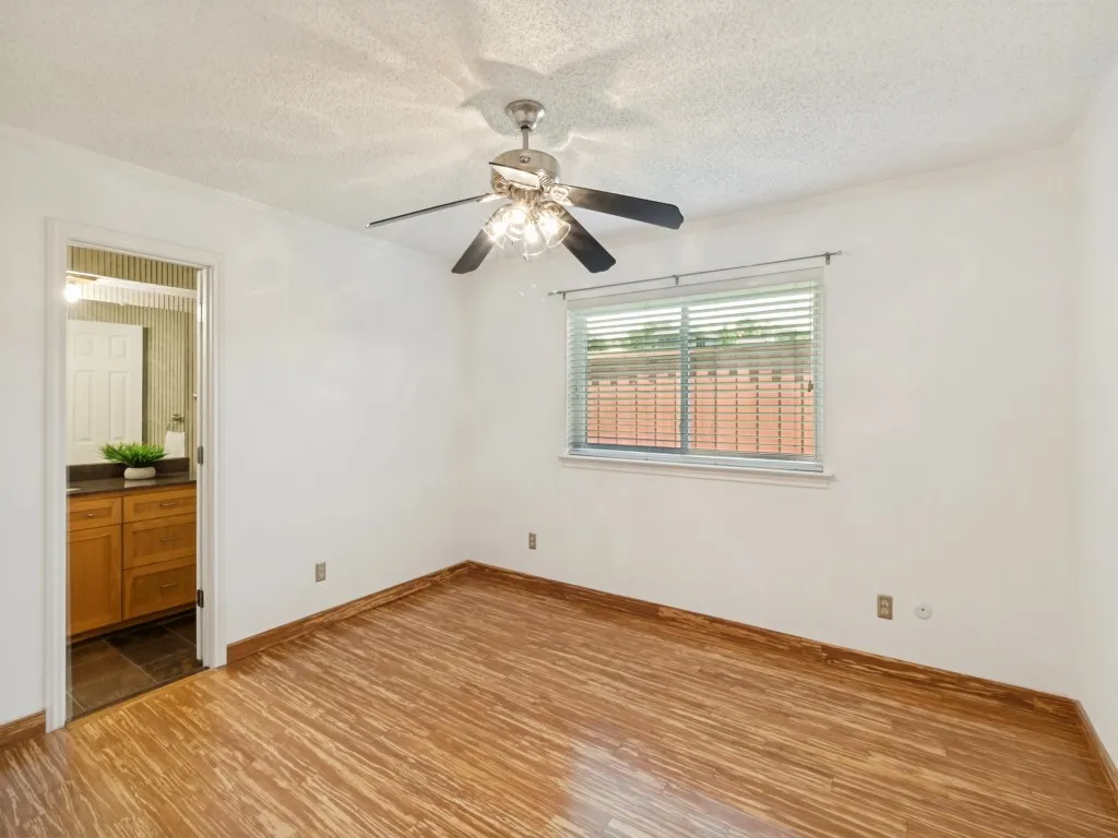 This bedroom measures approximately 13' x 11' and features a walk-in closet and bamboo tiger-strand wood floors!