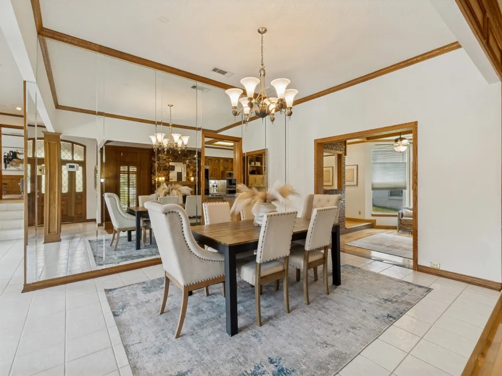 The dining room is ideally positioned between the kitchen and formal living area, creating a seamless flow that makes entertaining effortless!