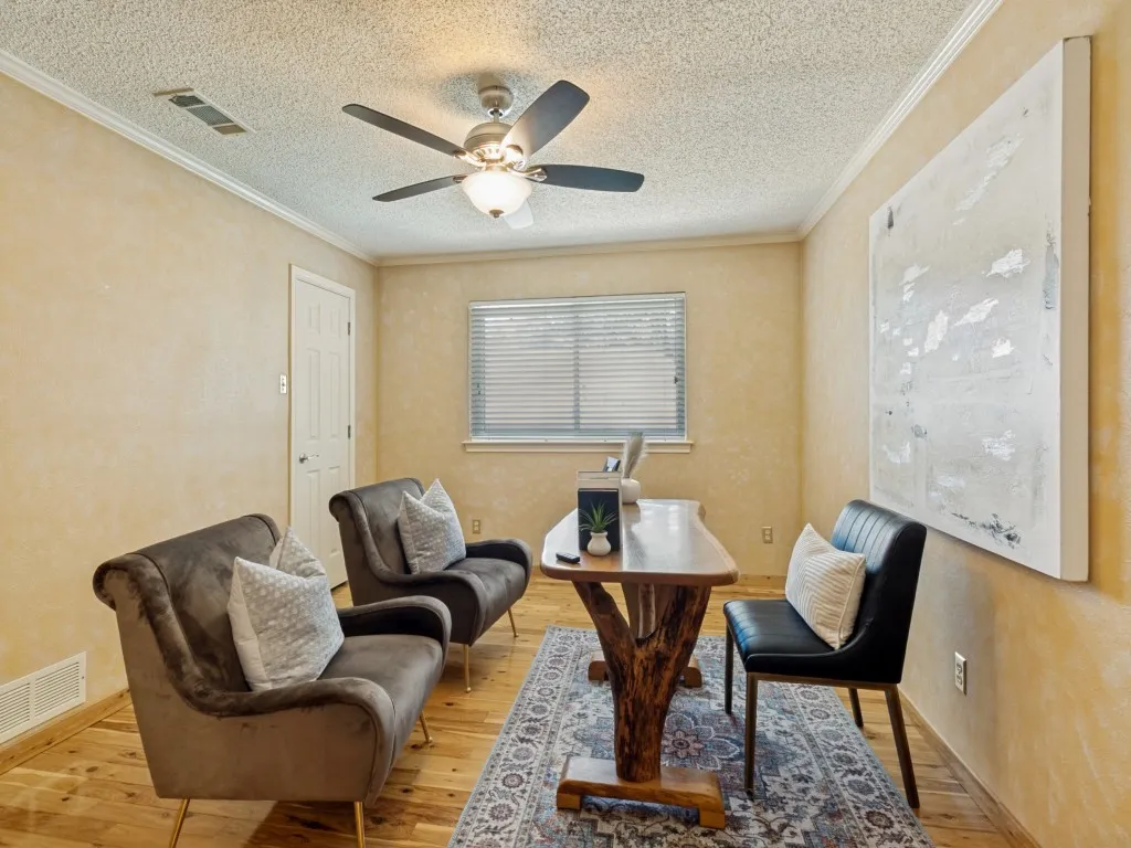 This spacious guest bedroom with a walk-in closet and Australian cypress wood floors measures approximately 14 x 14 and shares a full bath with a neighboring bedroom!