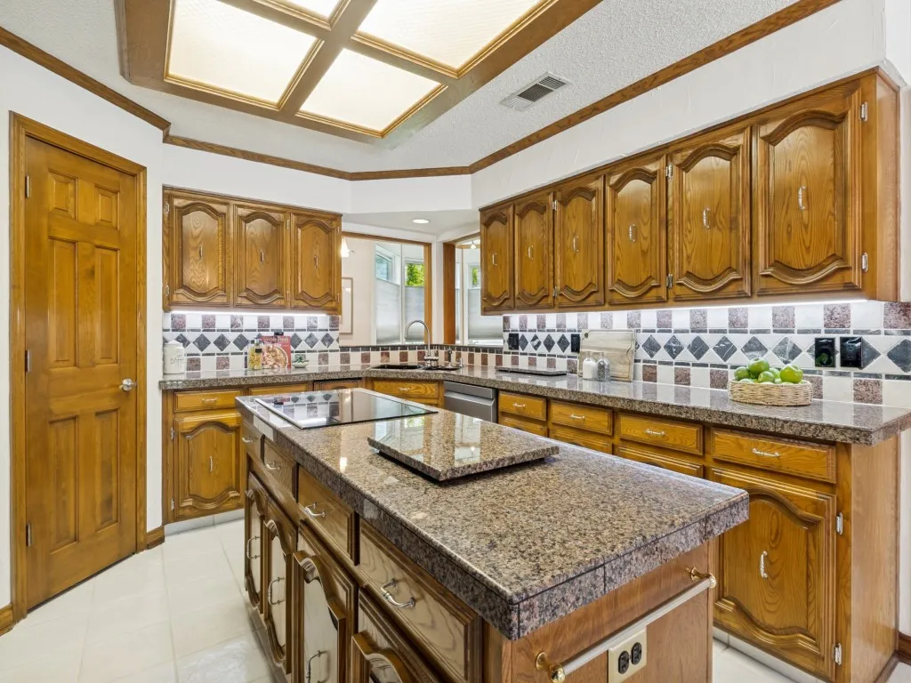 This view of the kitchen emphasizes the thoughtful pass-throughs to the adjacent office!