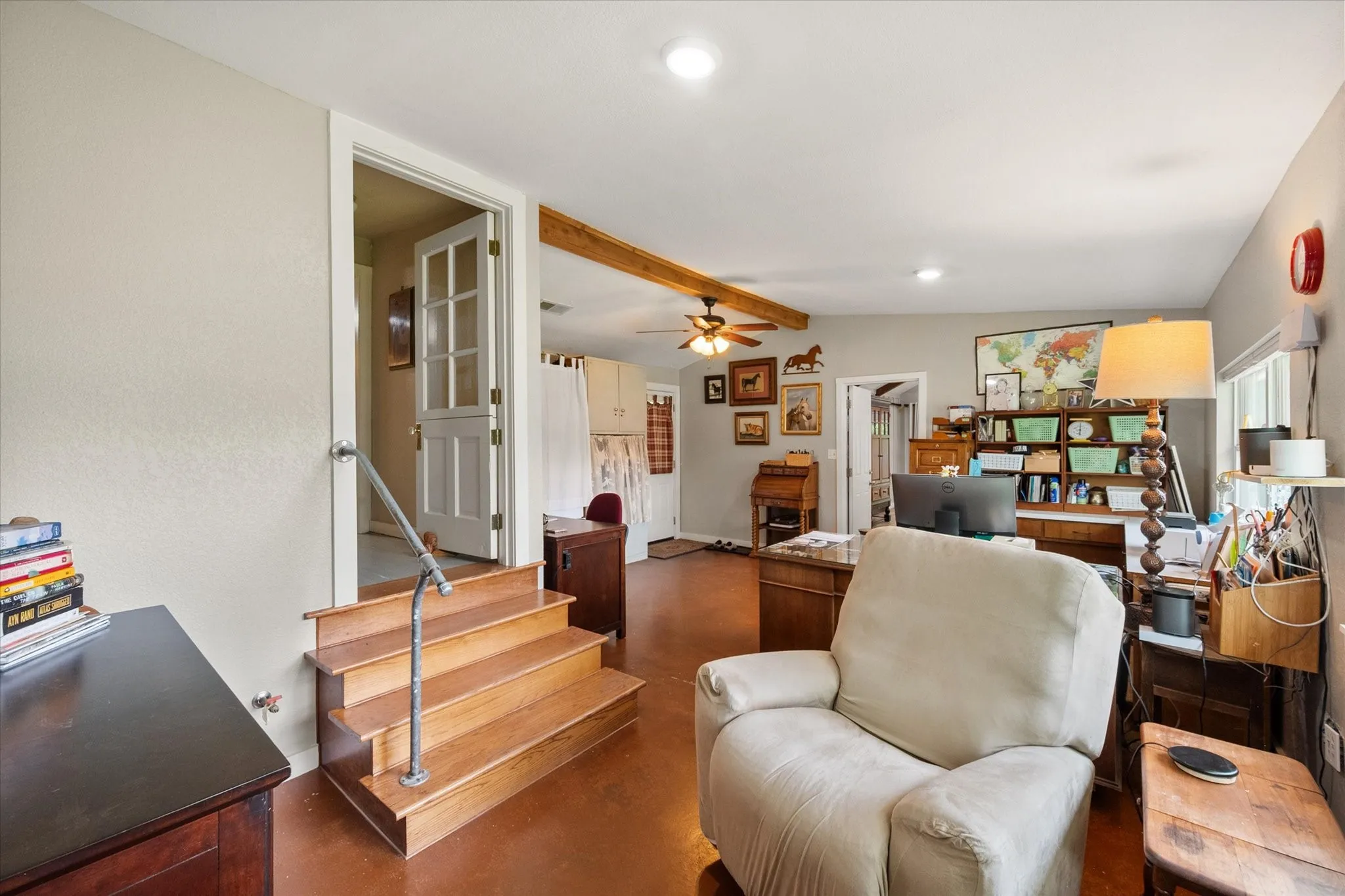 Interior space featuring wood-finish flooring, recessed lighting, and a visible wood beam accent