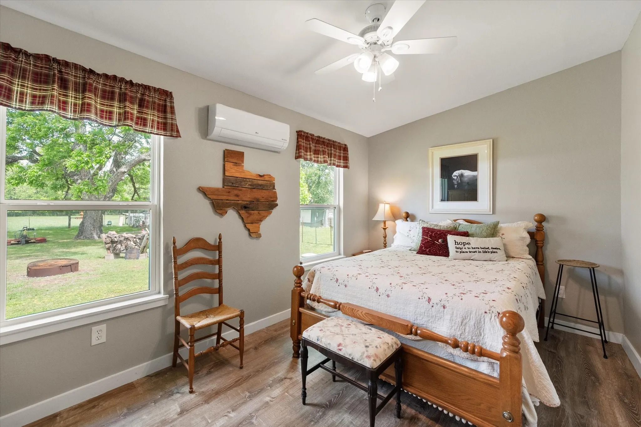 Interior room featuring light gray walls and wood-finish flooring