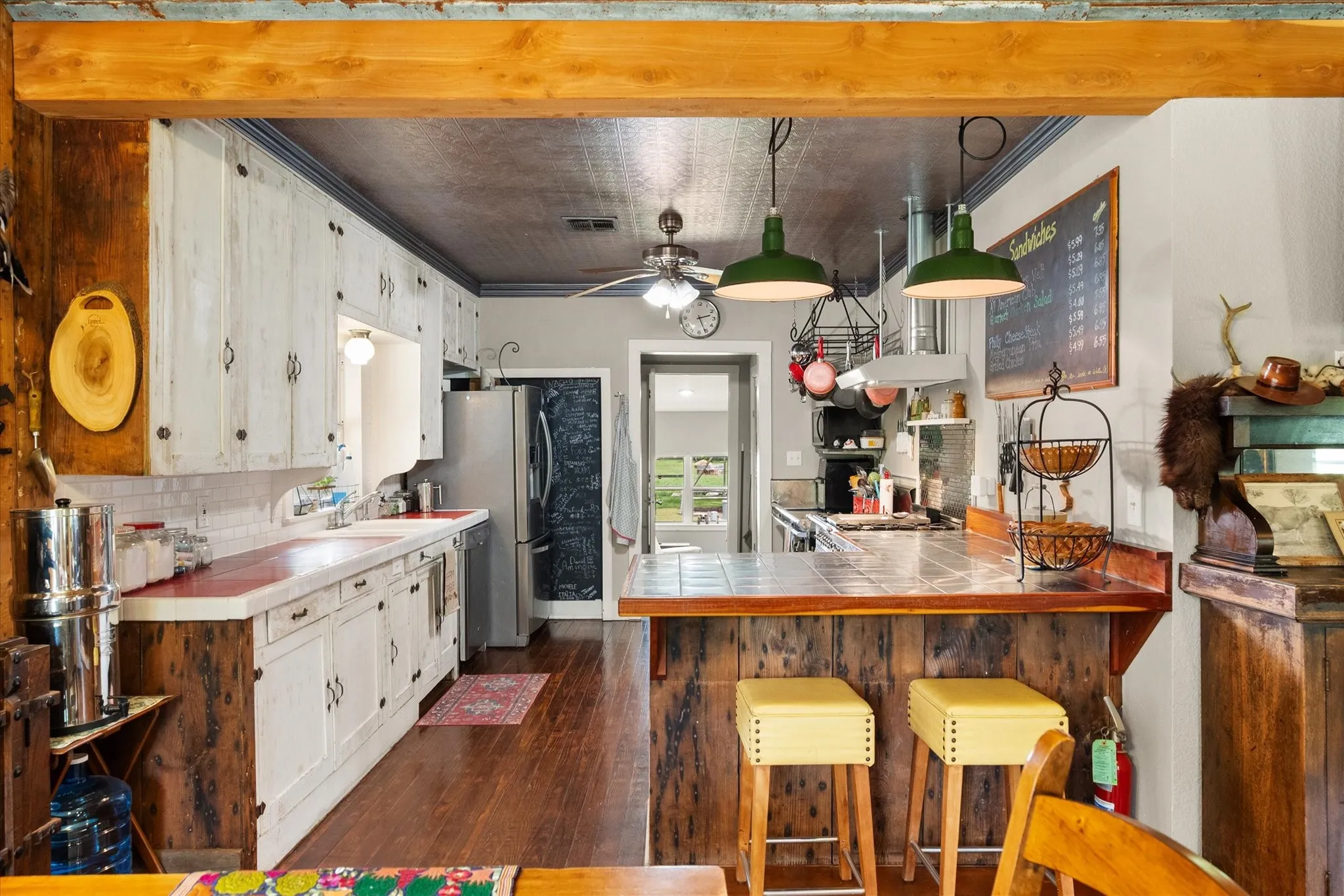 Kitchen featuring wood-finish flooring and a tile backsplash