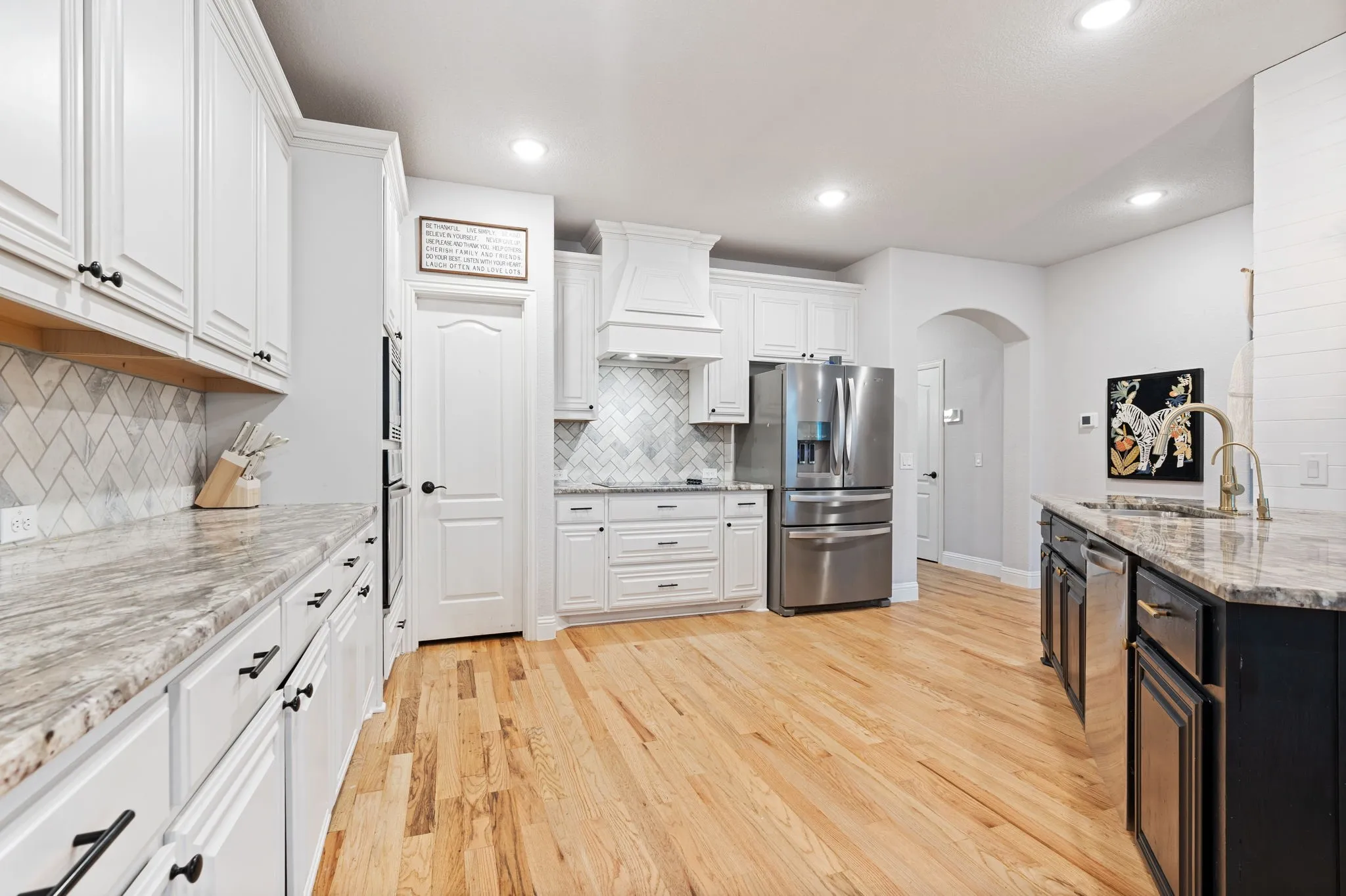 Massive Kitchen with gorgeous granite counters, and wood cabinets.