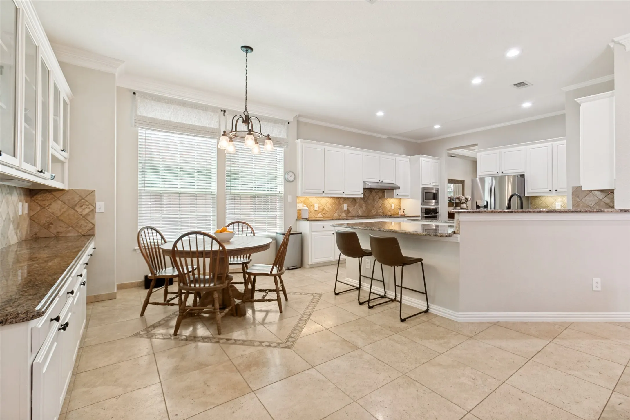 Spacious open and flowing kitchen and breakfast room  feature tremendous storage and a huge walk in pantry.