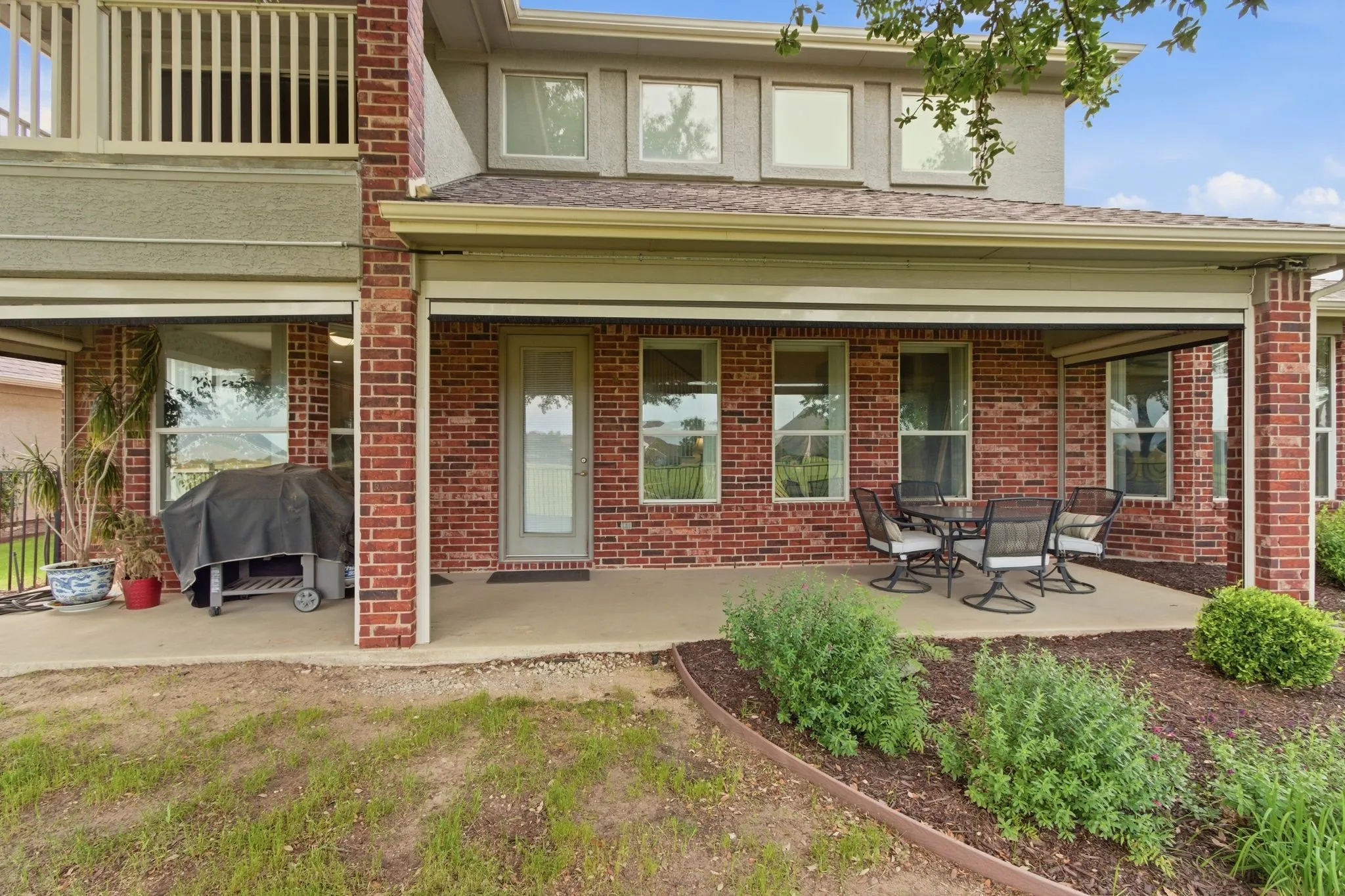 Covered patio featuring a balcony, wonderful morning and evening views of the Wildhorse golf course.
