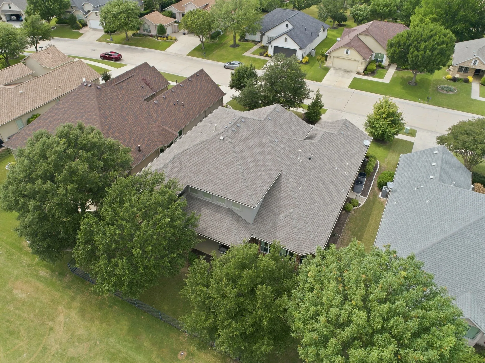 Aerial view of 9601 Grandview with a gray shingle roof