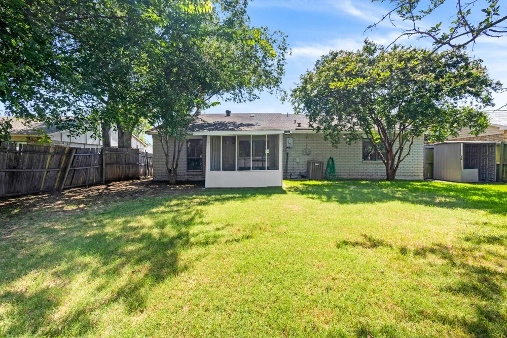 Large yard with screened in porch & shed