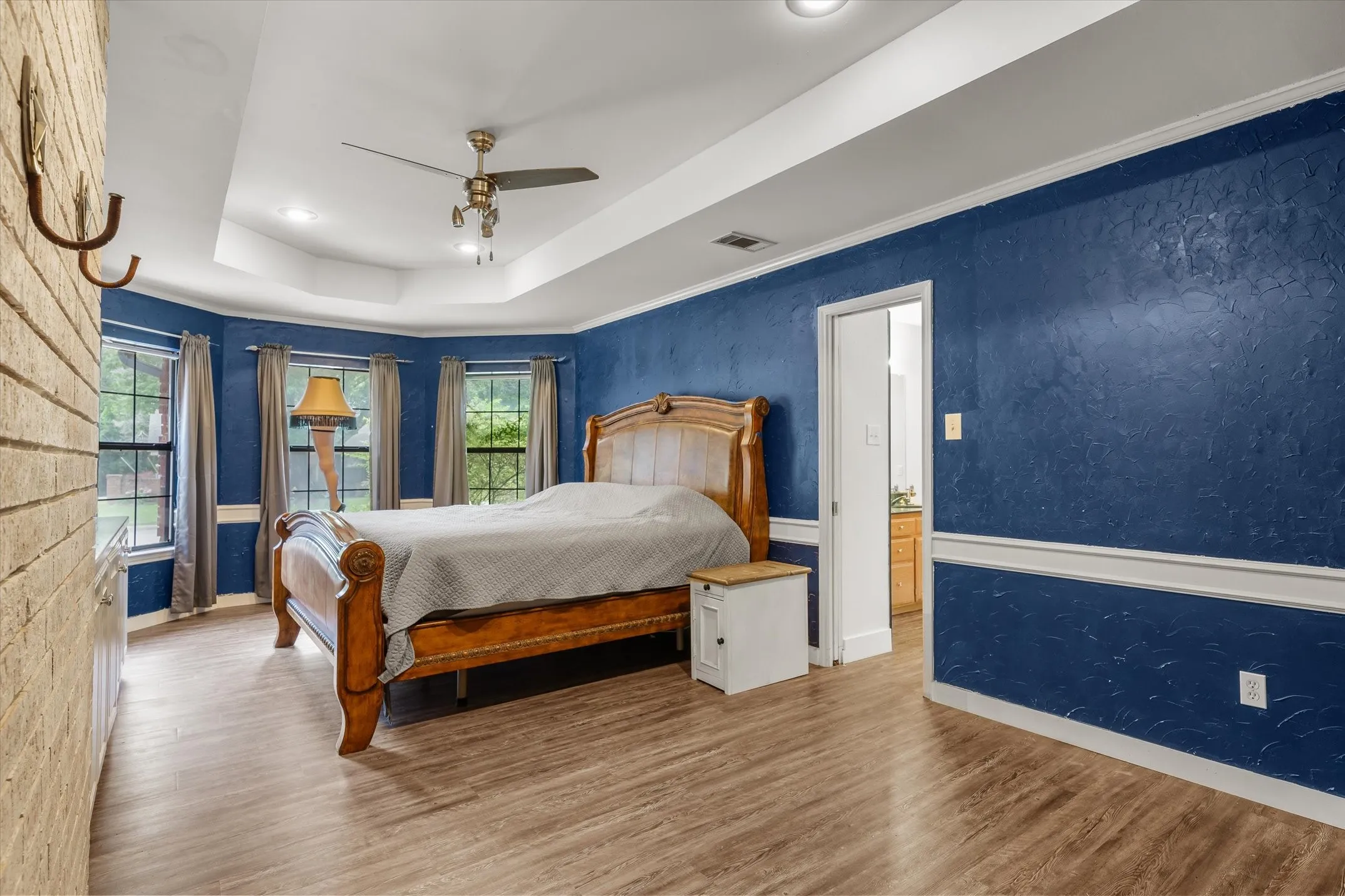 Primary bedroom with bay windows