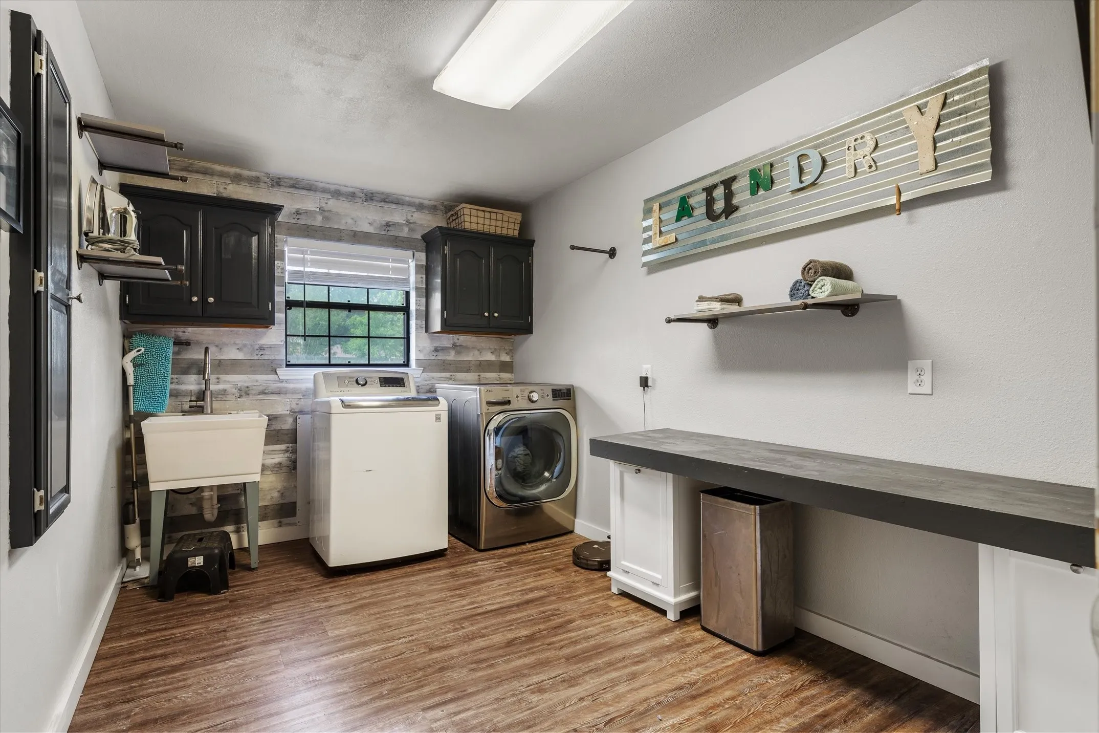 Storage, built-in ironing board, counterspace and sink