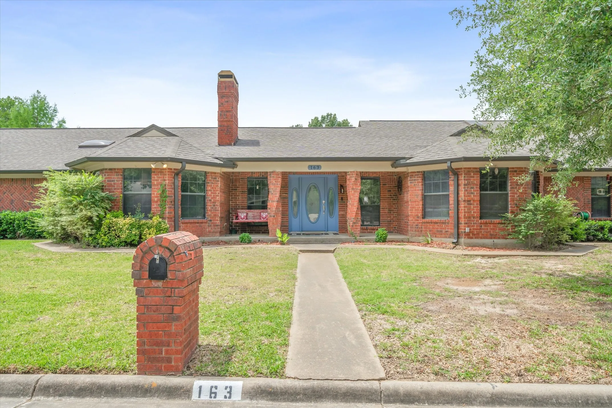 Striking, brick home welcomes large families and room for entertaining.