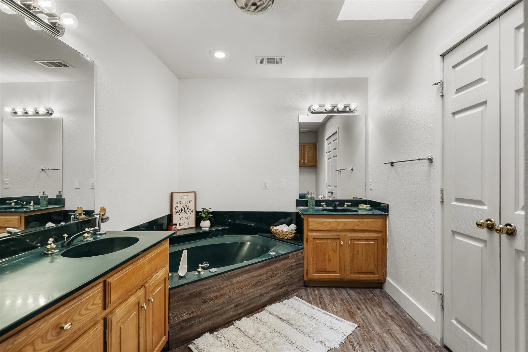 Ensuite with double vanity, garden tub & walk-in closer