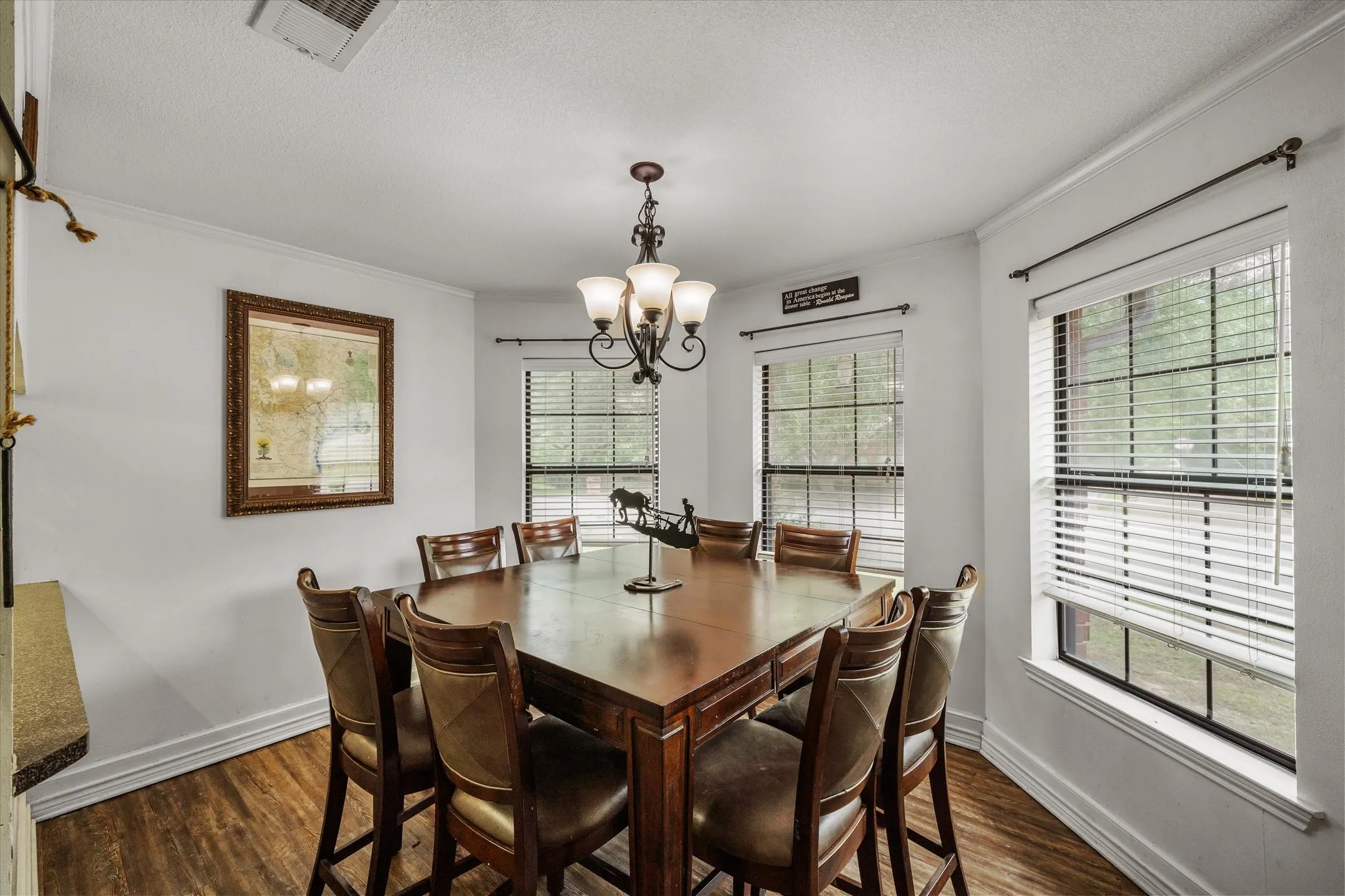 Dining area with bay window looking over the front yard.