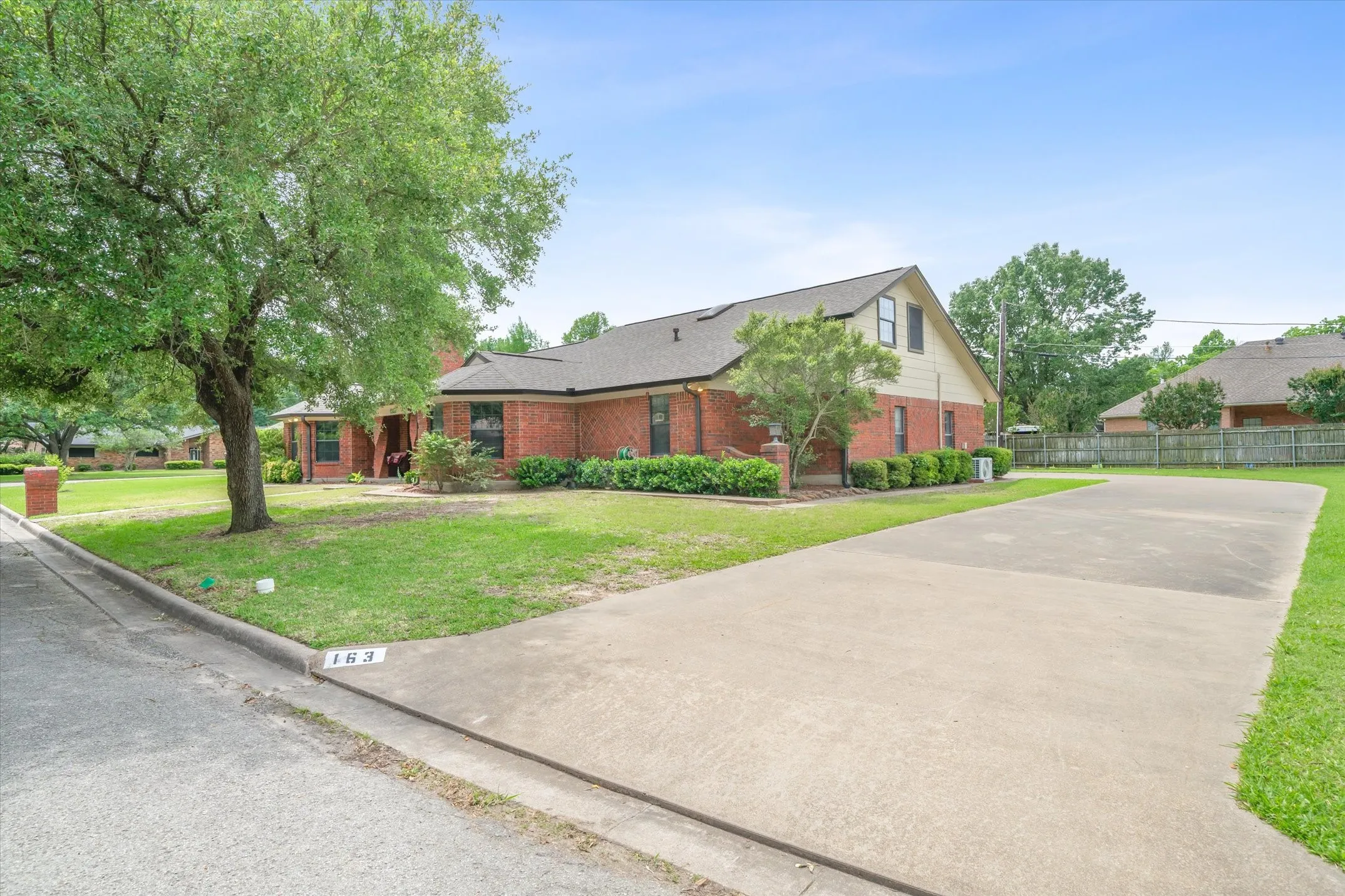 Corner lot, extra yard space, plenty of parking, curb appeal