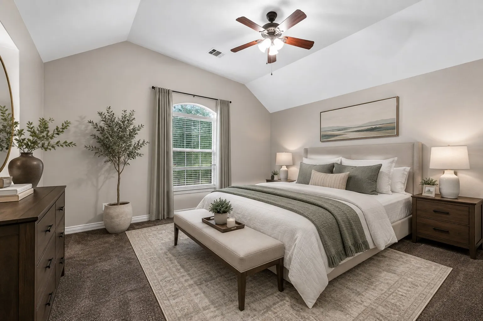 Vaulted ceiling with a ceiling fan, arched window with blinds, carpeted flooring, and a neutral color palette