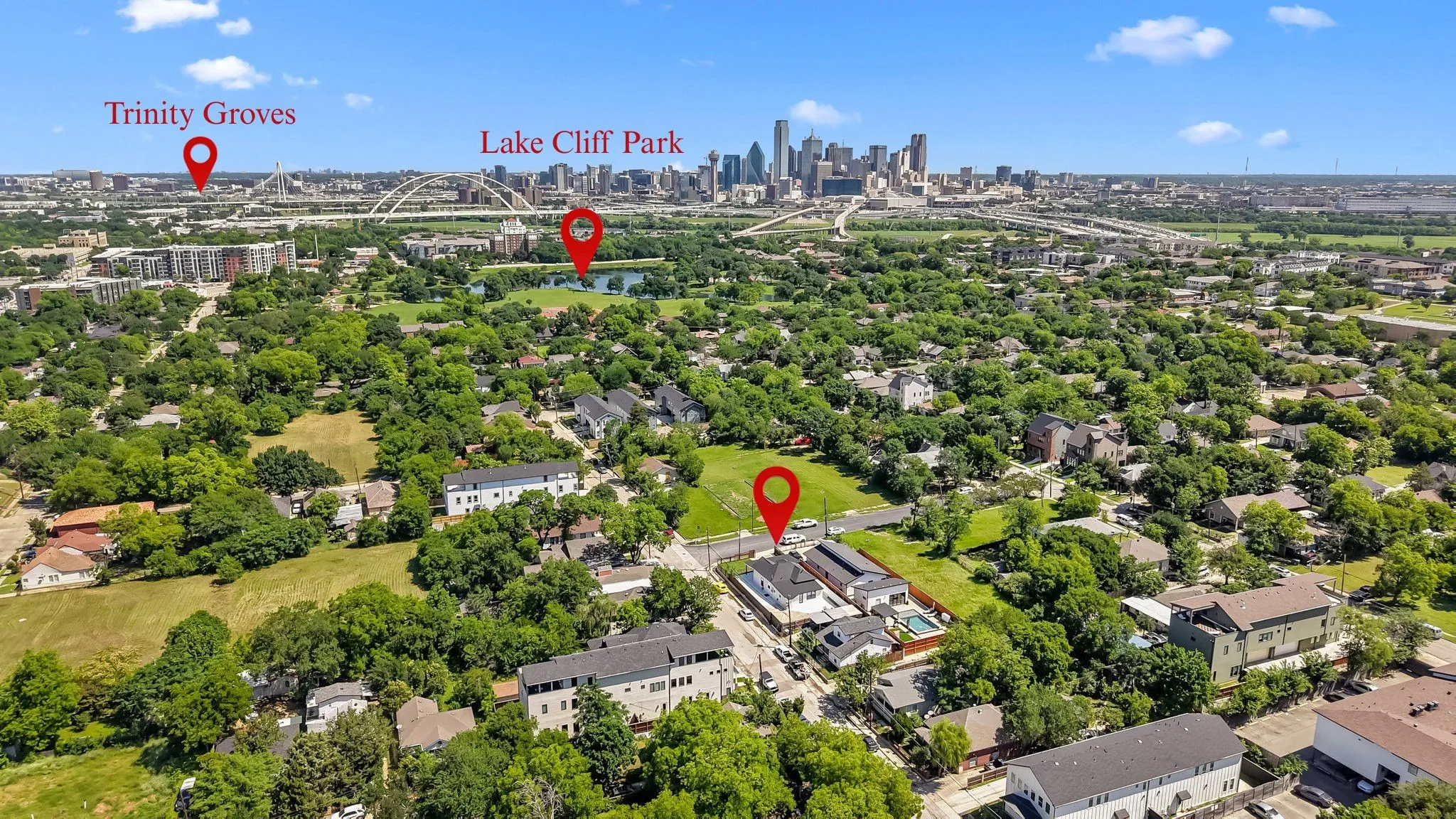 Aerial perspective showcasing a dense urban canopy, visible city skyline, Lake Cliff Park, and Trinity Groves