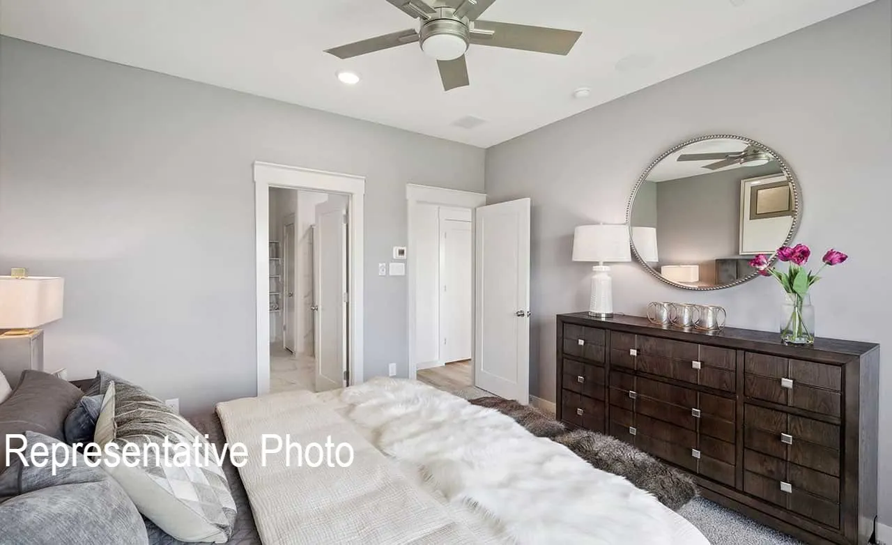 Interior bedroom featuring light gray walls, a ceiling fan with integrated lighting, and recessed ceiling lights
