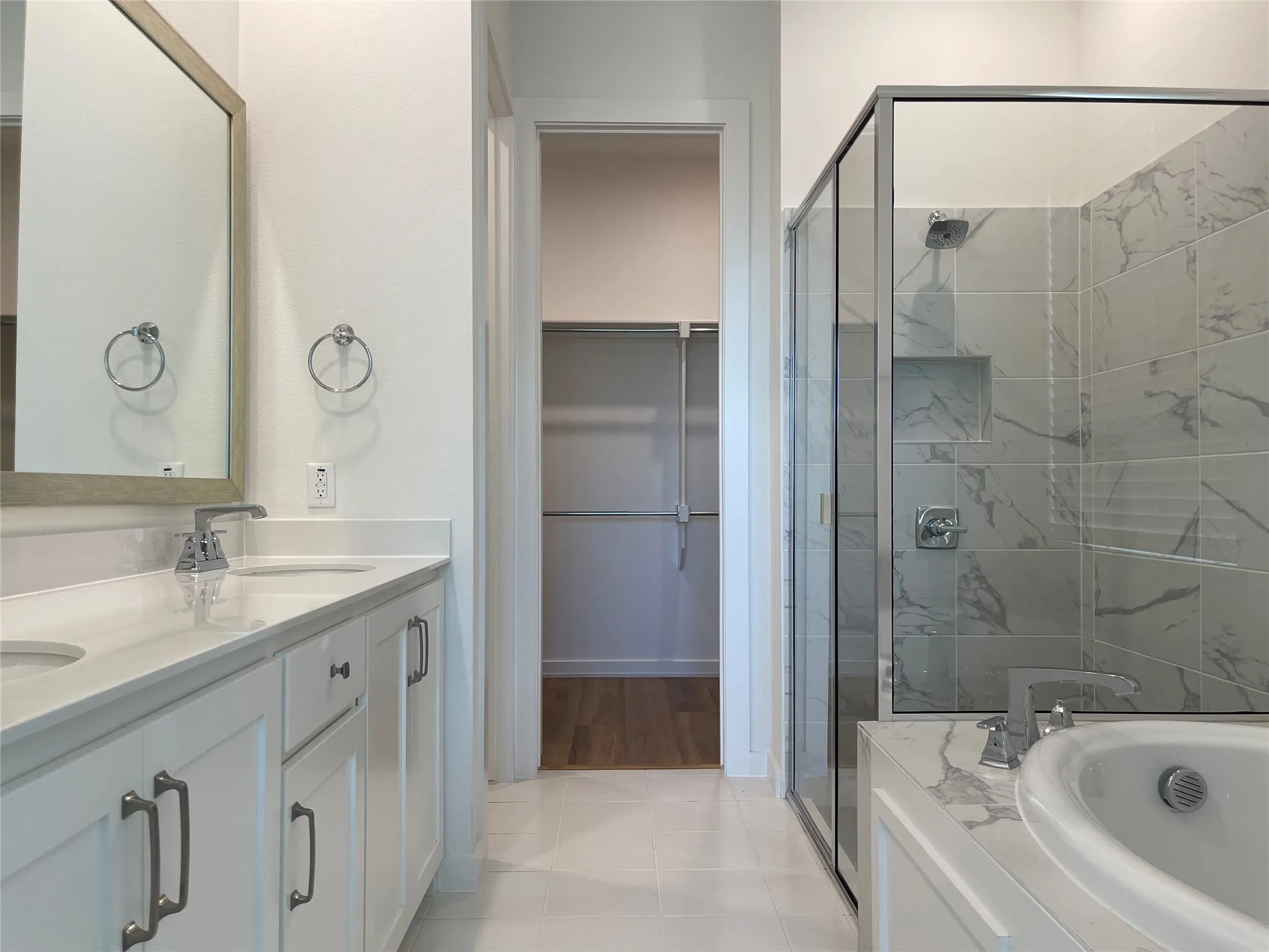 Double vanity with undermount sinks and chrome fixtures