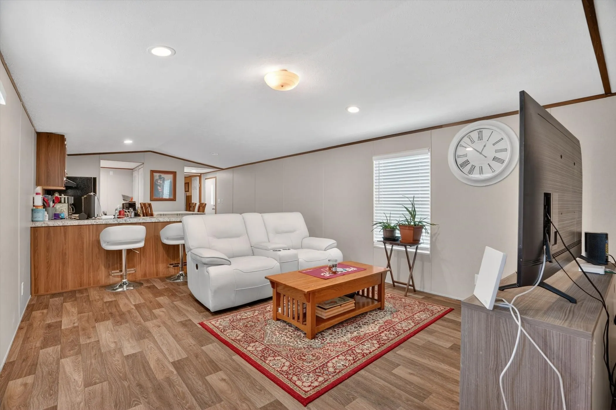cozy seating in living area convenient to kitchen and dining