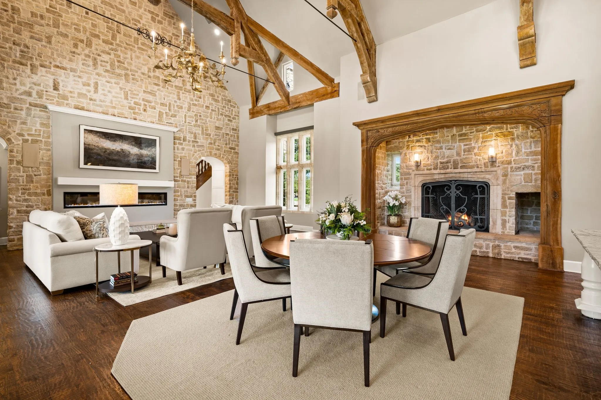Enjoy casual dining right off the kitchen with new chandelier lighting and a beautiful stone fireplace.