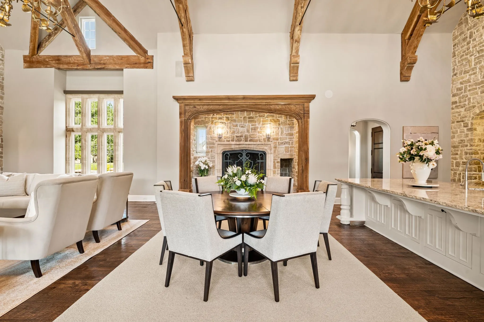 Enjoy casual dining right off the kitchen with new chandelier lighting and a beautiful stone fireplace.