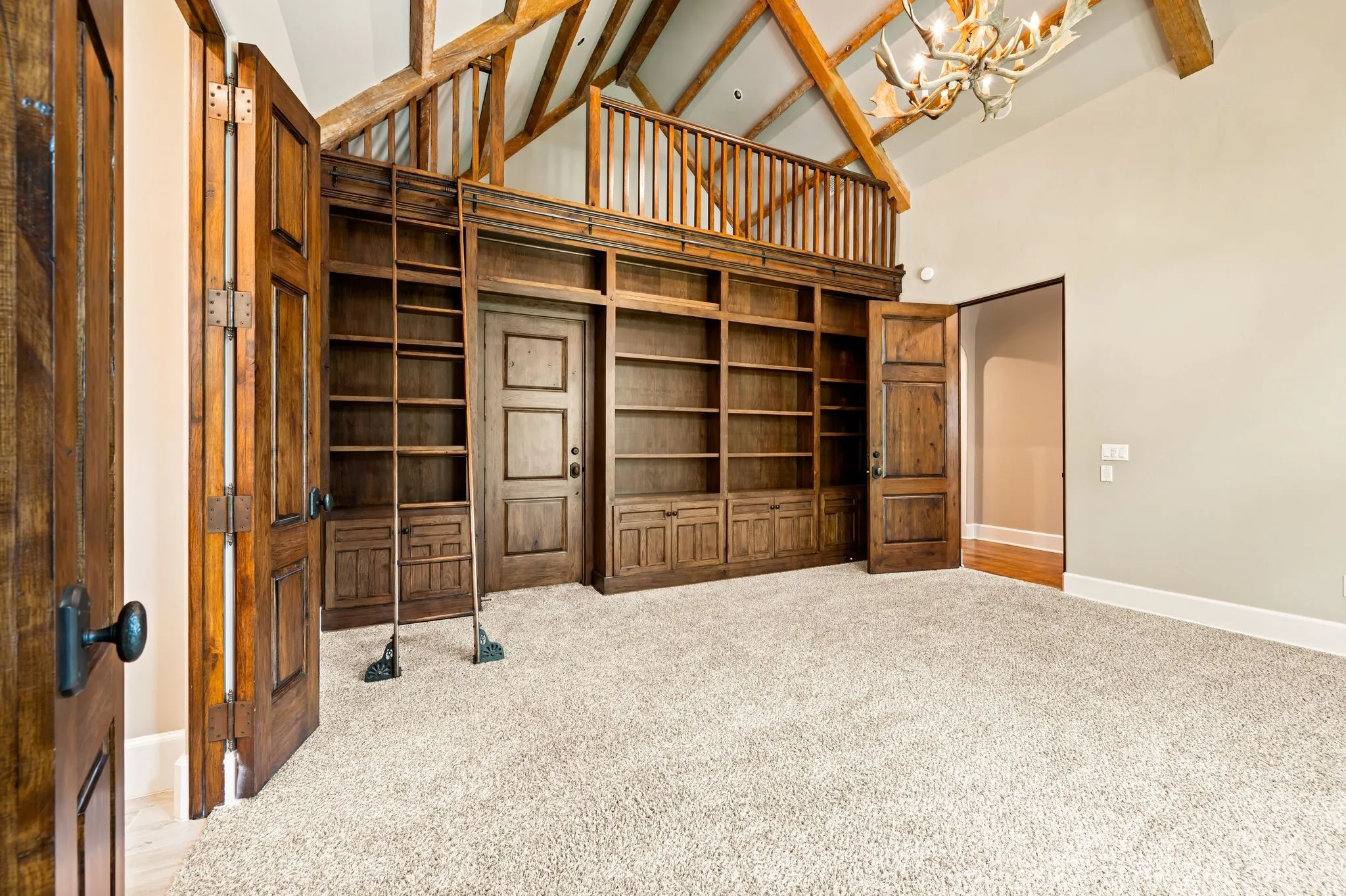 Secondary up bedroom with ensuite baths, and walk in closets.  This bedroom features a fun loft space and custom shelving.