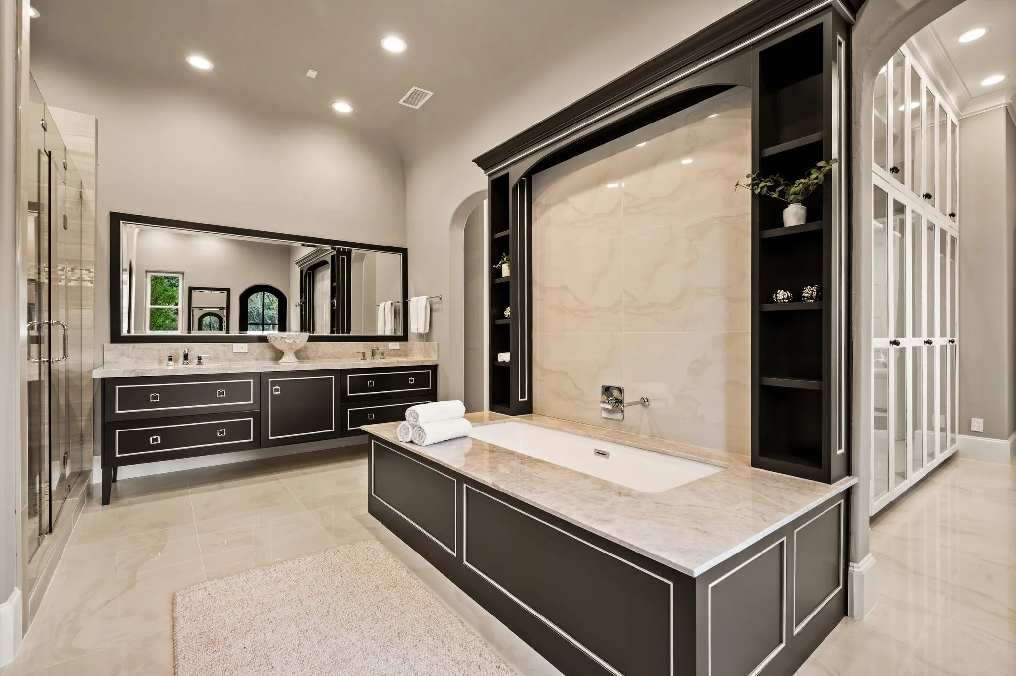 Updated primary bath with dual vanities, and make-up vanity.
