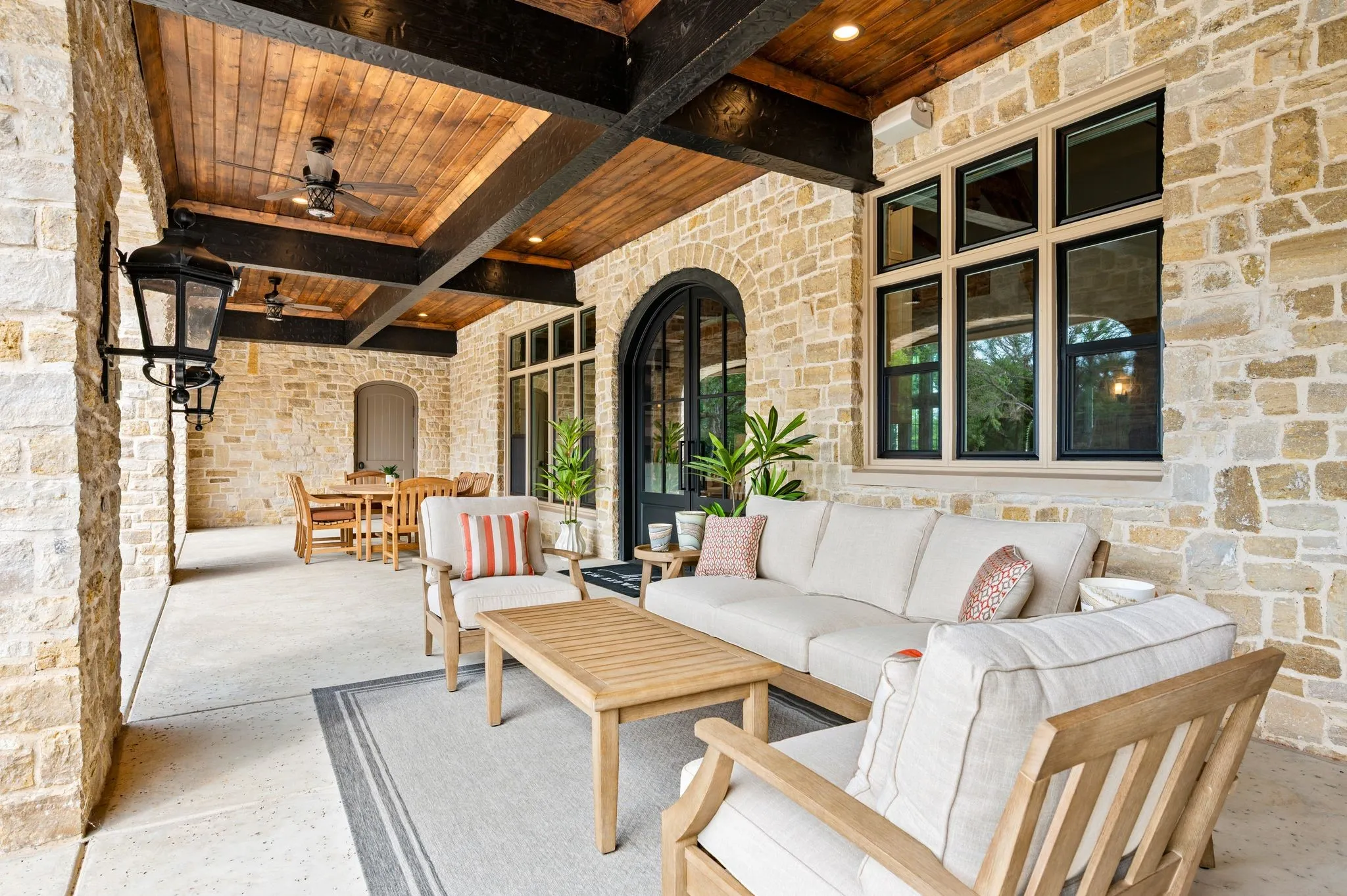View of patio with dining area and sitting area. There is also a built-in grill located conveniently off kitchen area.