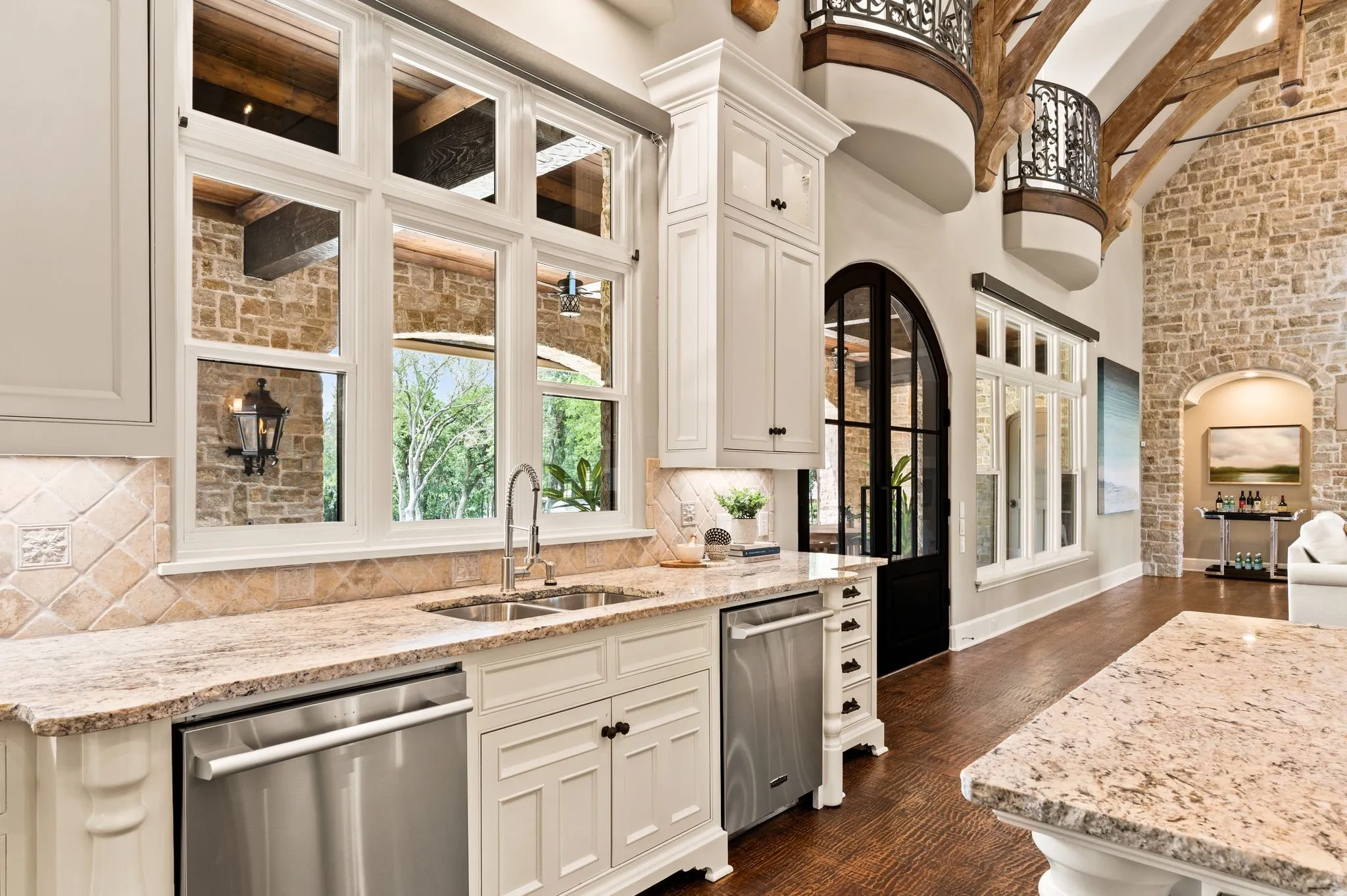 This kitchen is equipped with two sinks and dual dishwashers.