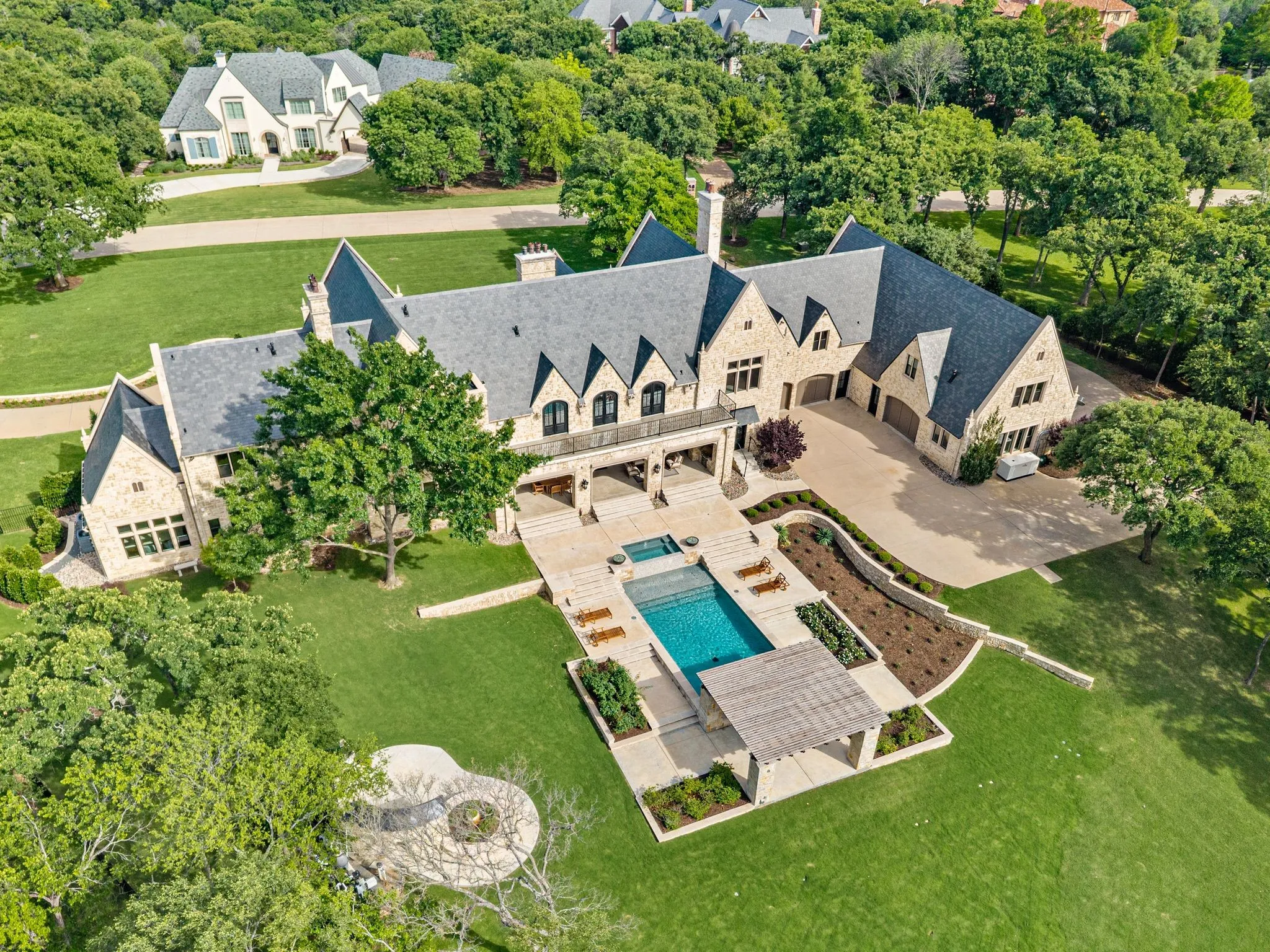 Sprawling 2 acre estate offering privacy and tucked behind a beautiful greenbelt.