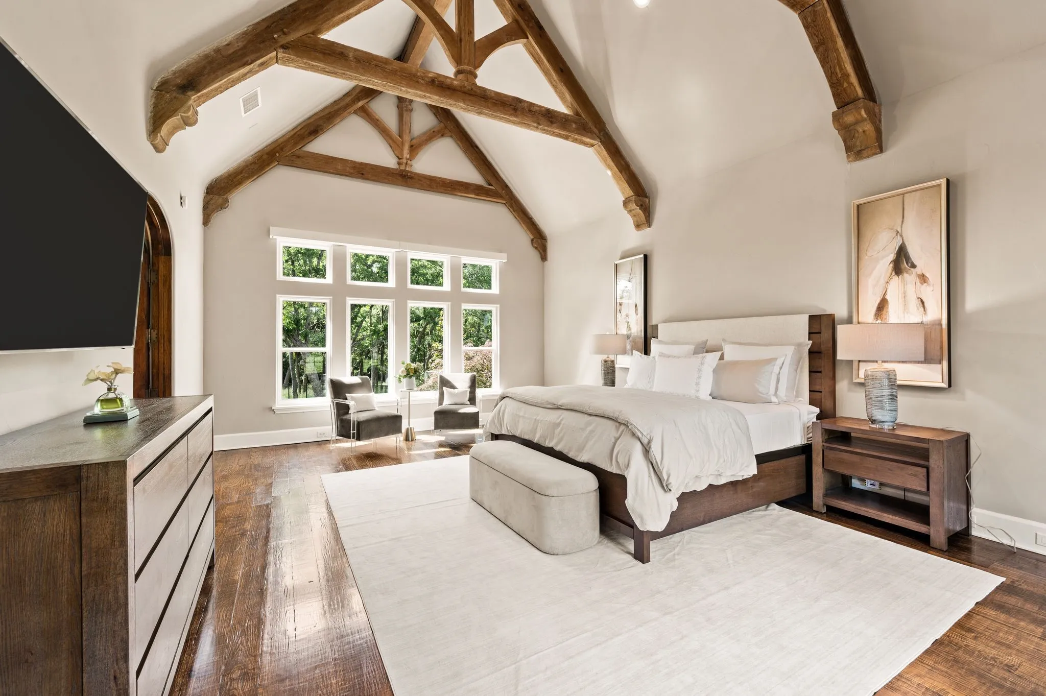 Primary suite with ample light and relaxing views.