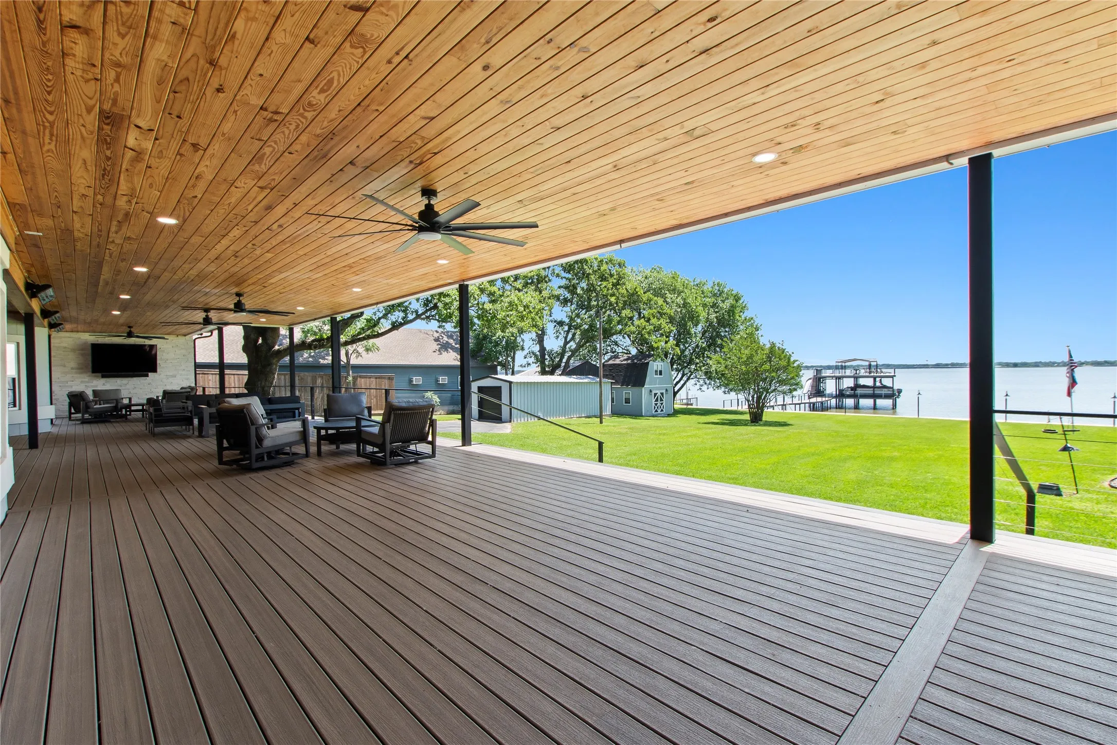 Expansive 1960 square foot composite deck with multiple entertaining spaces.