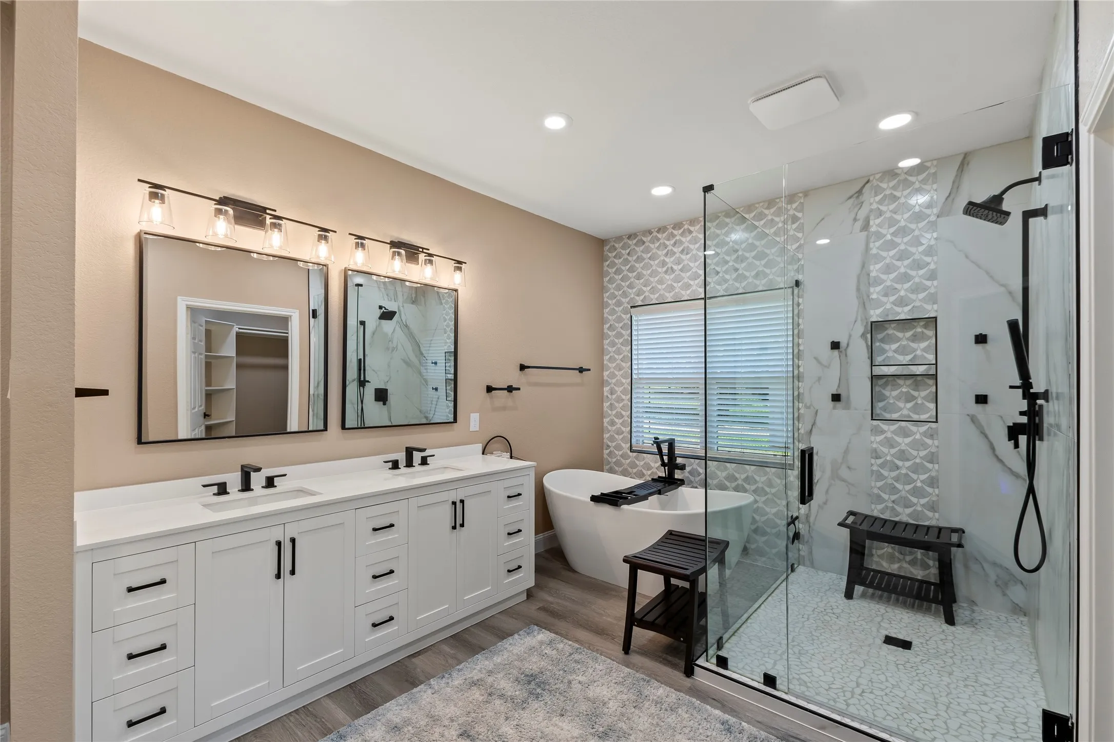 Soaking Tub, Walk In Shower, Dual Sink Vanities and not pictured is a separate makeup vanity.