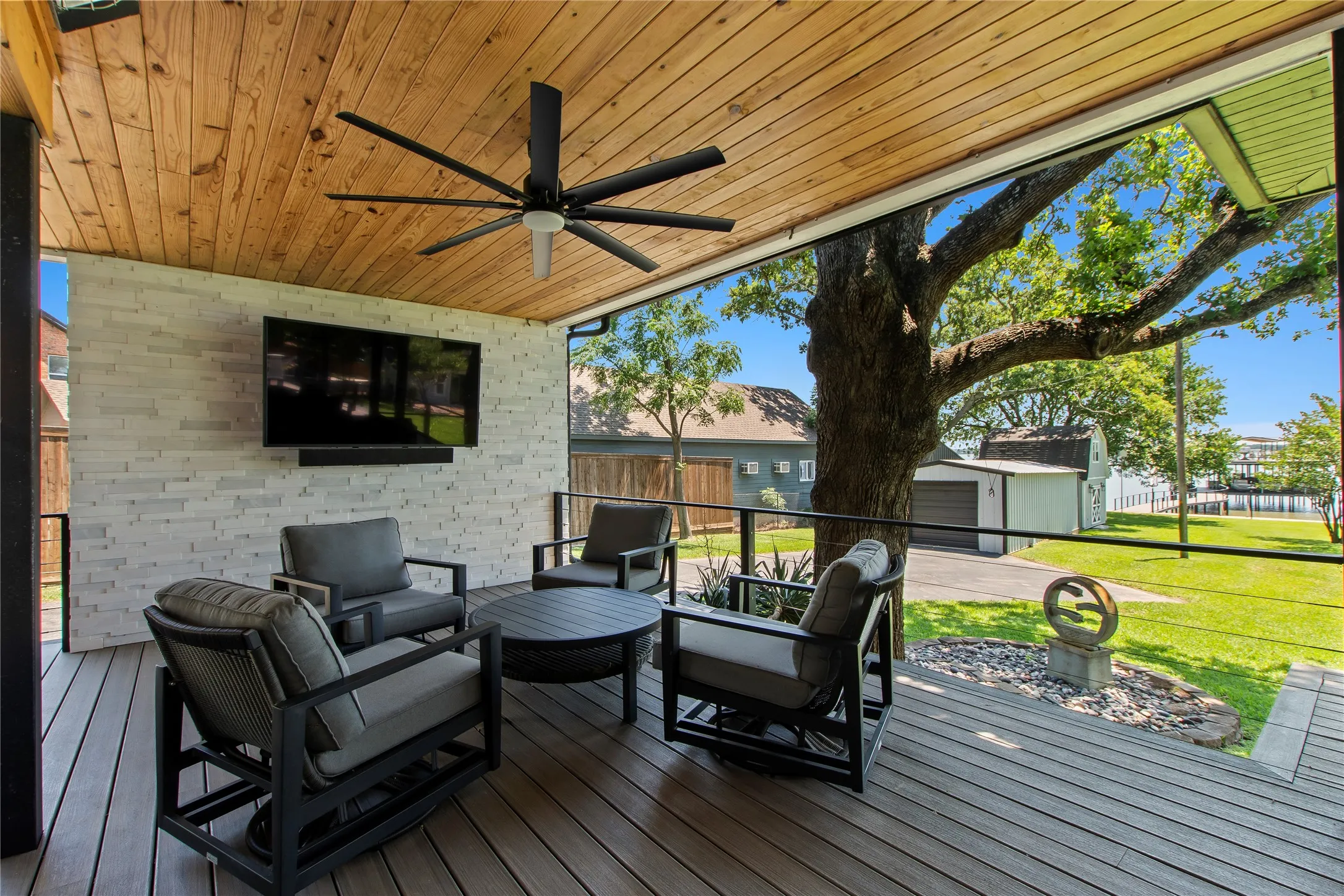 Mounted outdoor TV for game days and movie nights.